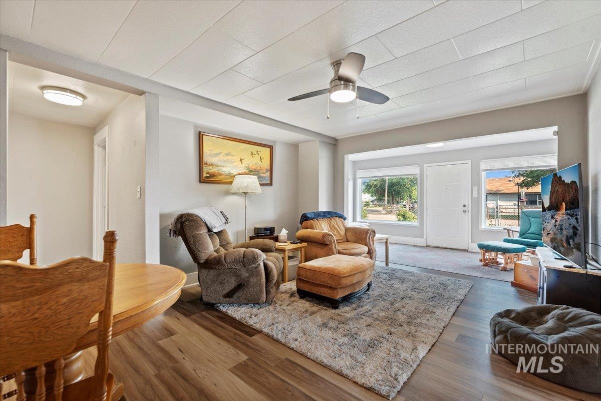 Living room featuring wood finished floors and ceiling fan