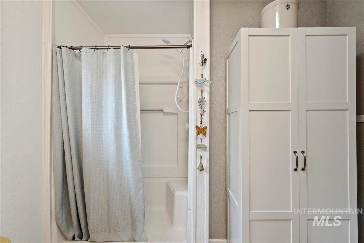 Bathroom featuring a shower stall