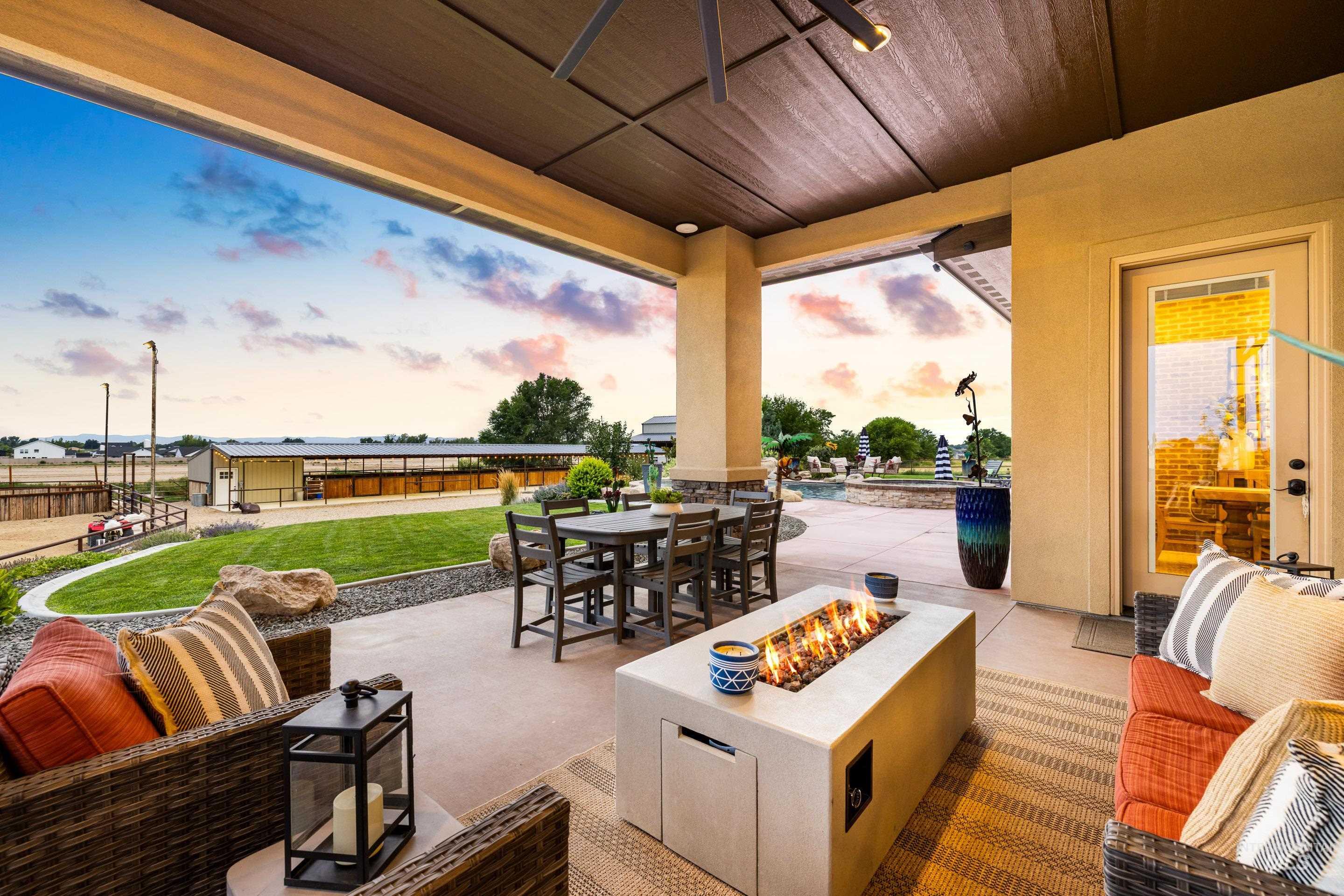 View of patio featuring an outdoor living space with a fire pit and outdoor dining area