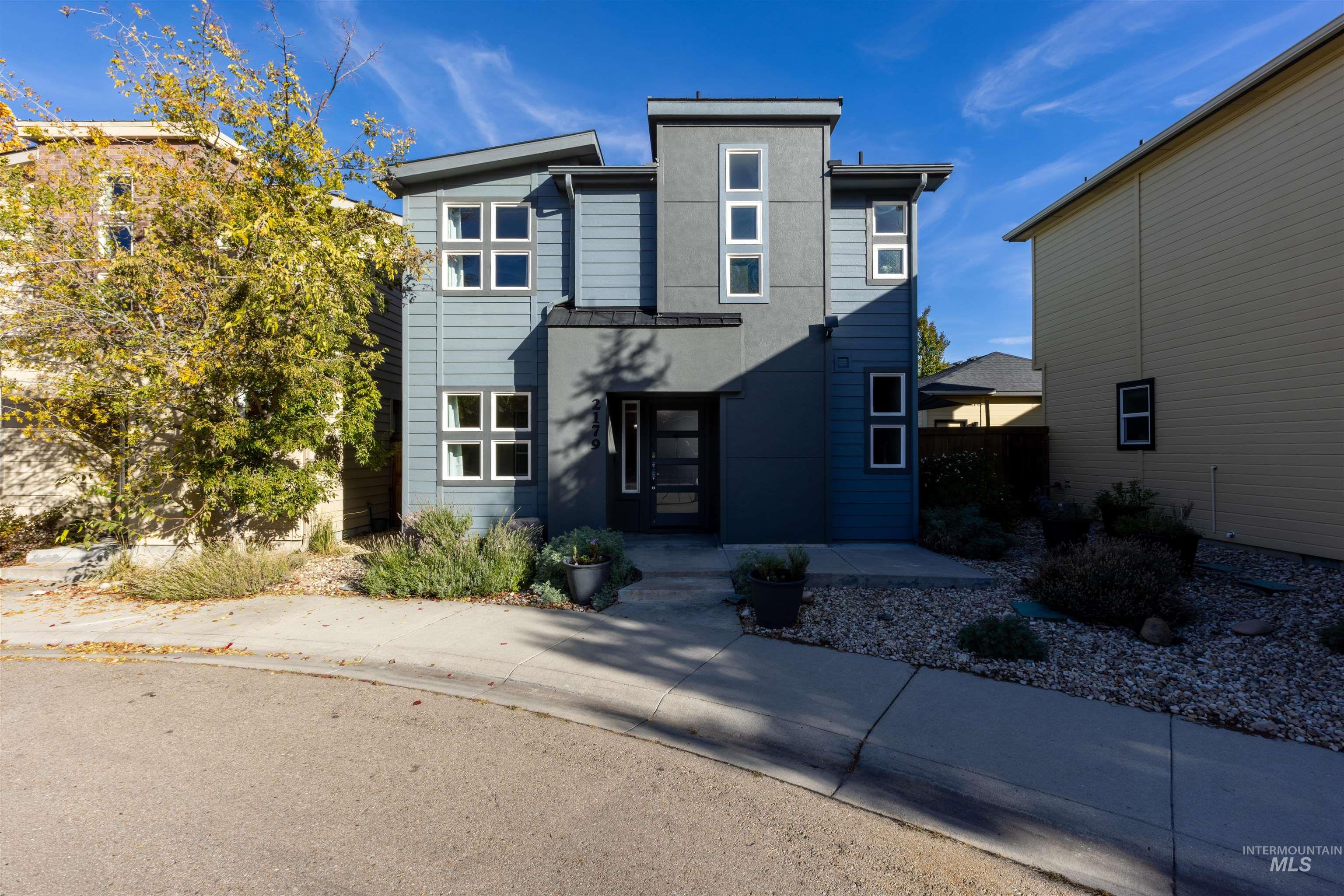 Contemporary home featuring stucco siding