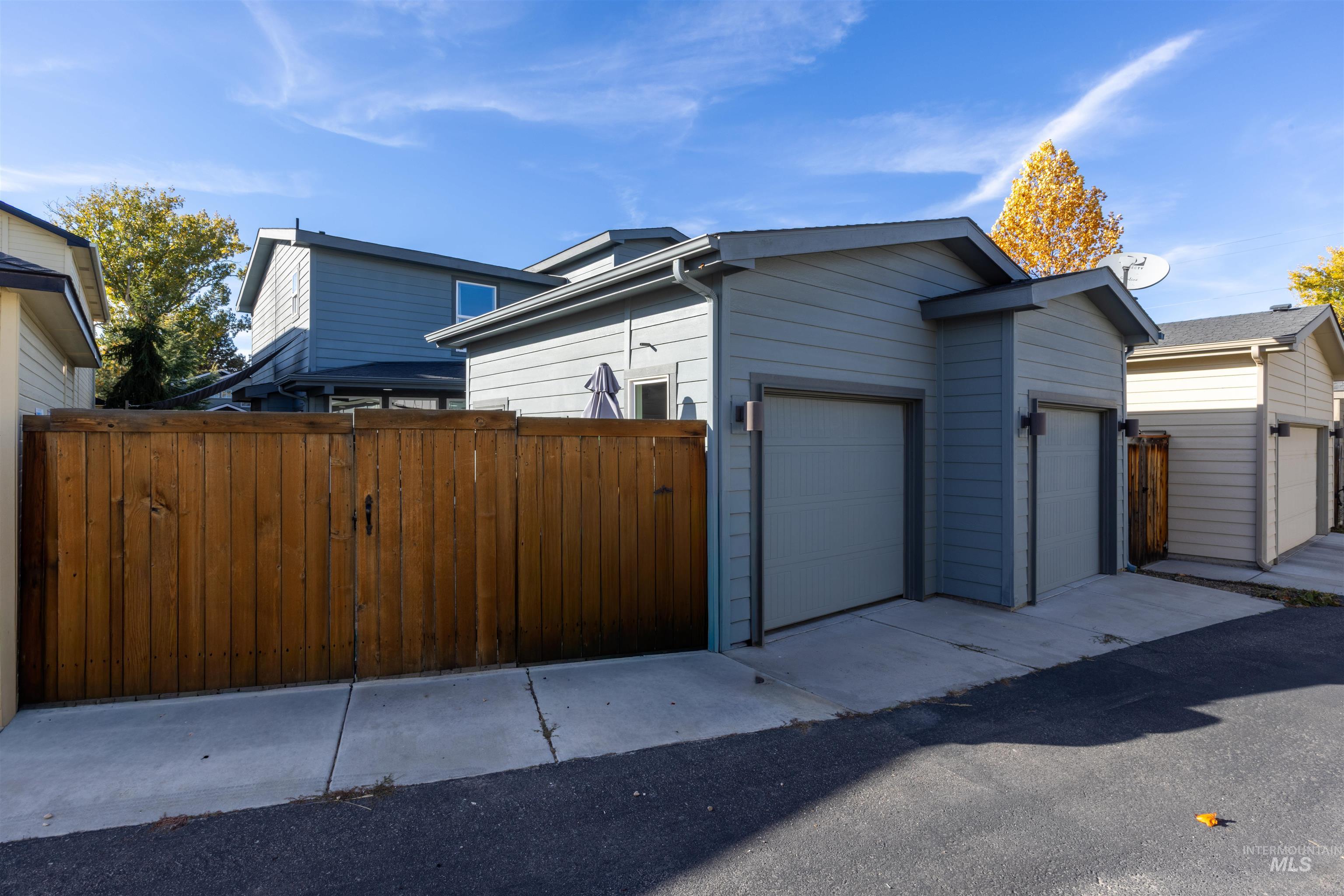View of property exterior with a garage