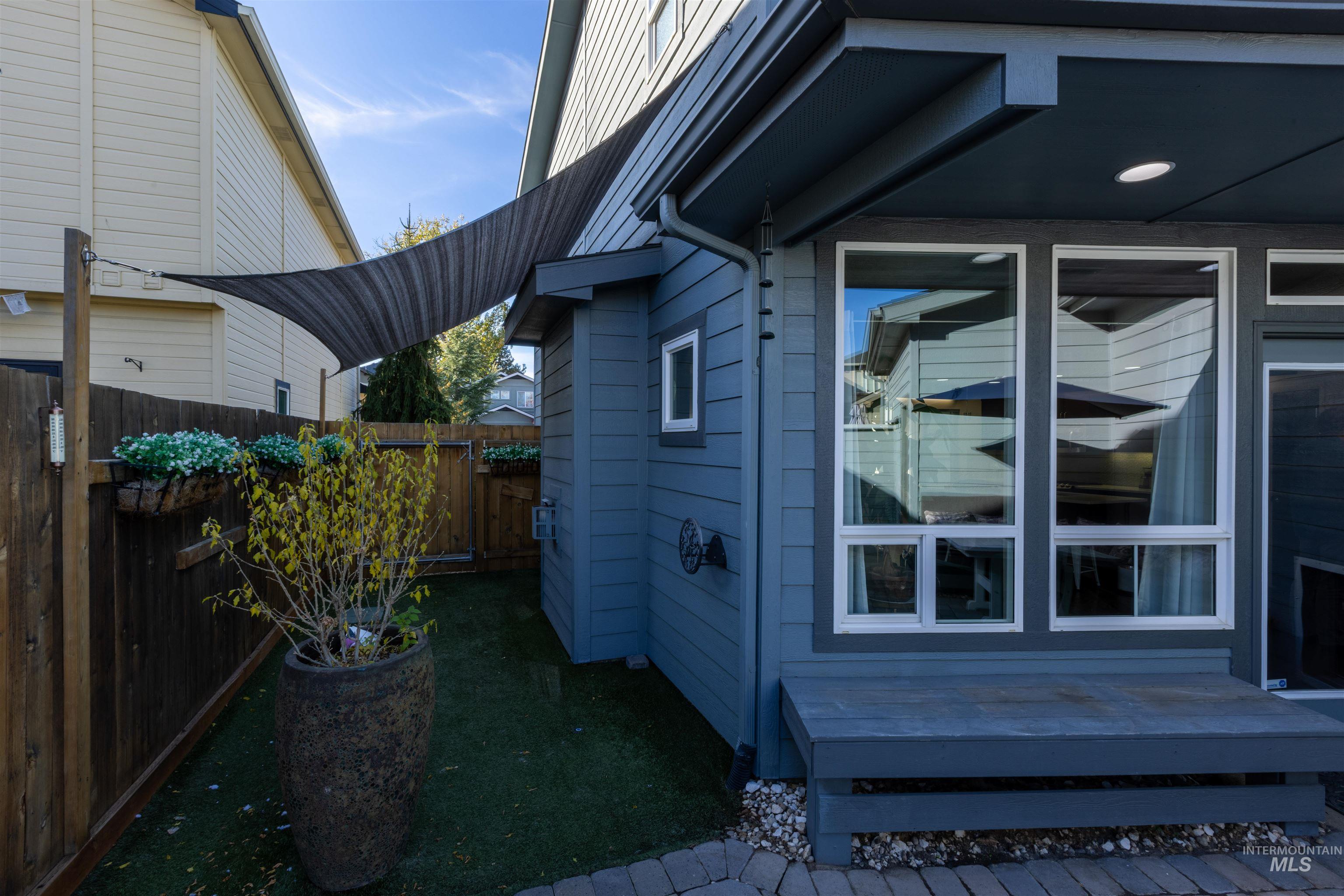 View of side of home featuring a deck