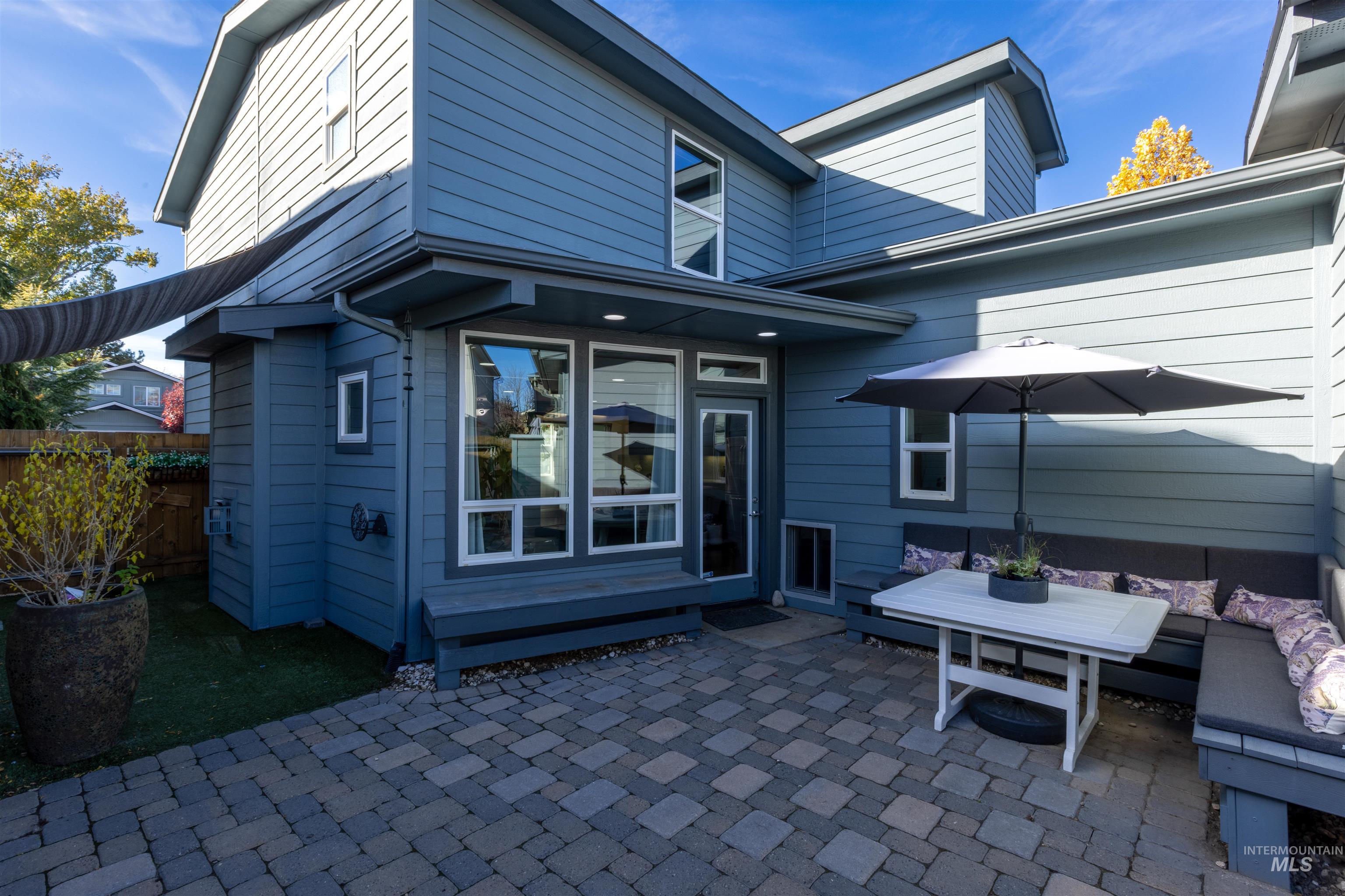 Back of property with a patio area