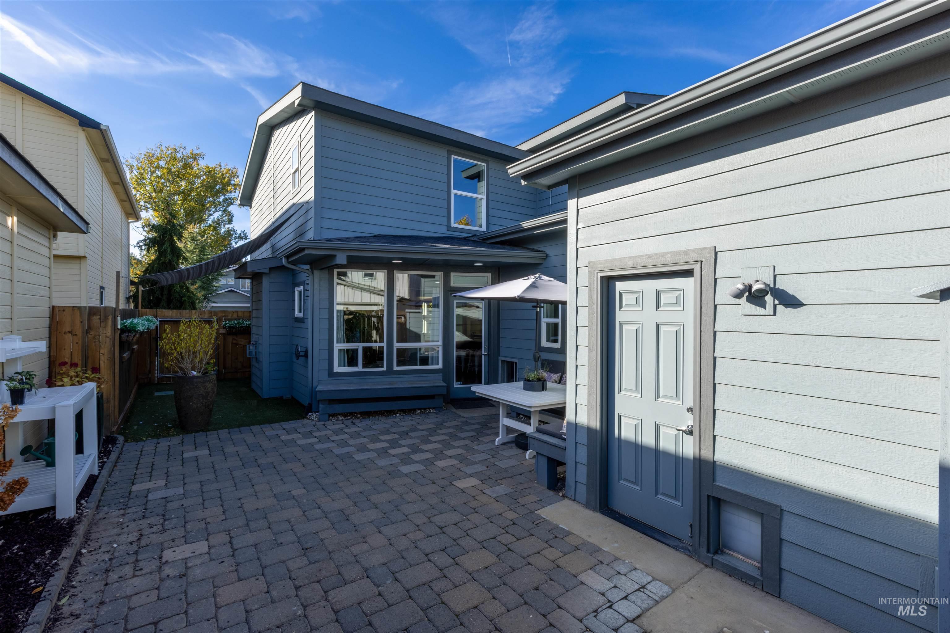 Doorway to property featuring a patio area