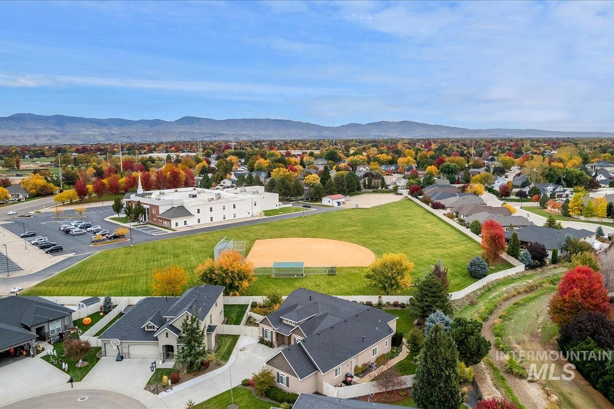 Aerial view of residential area featuring mountains