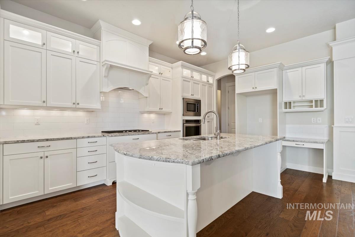 Kitchen featuring backsplash, open shelves, white cabinets, dark wood finished floors, and recessed lighting