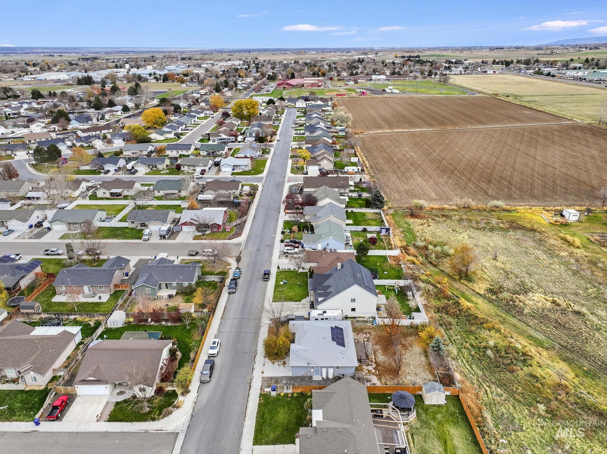 View of property location with nearby suburban area