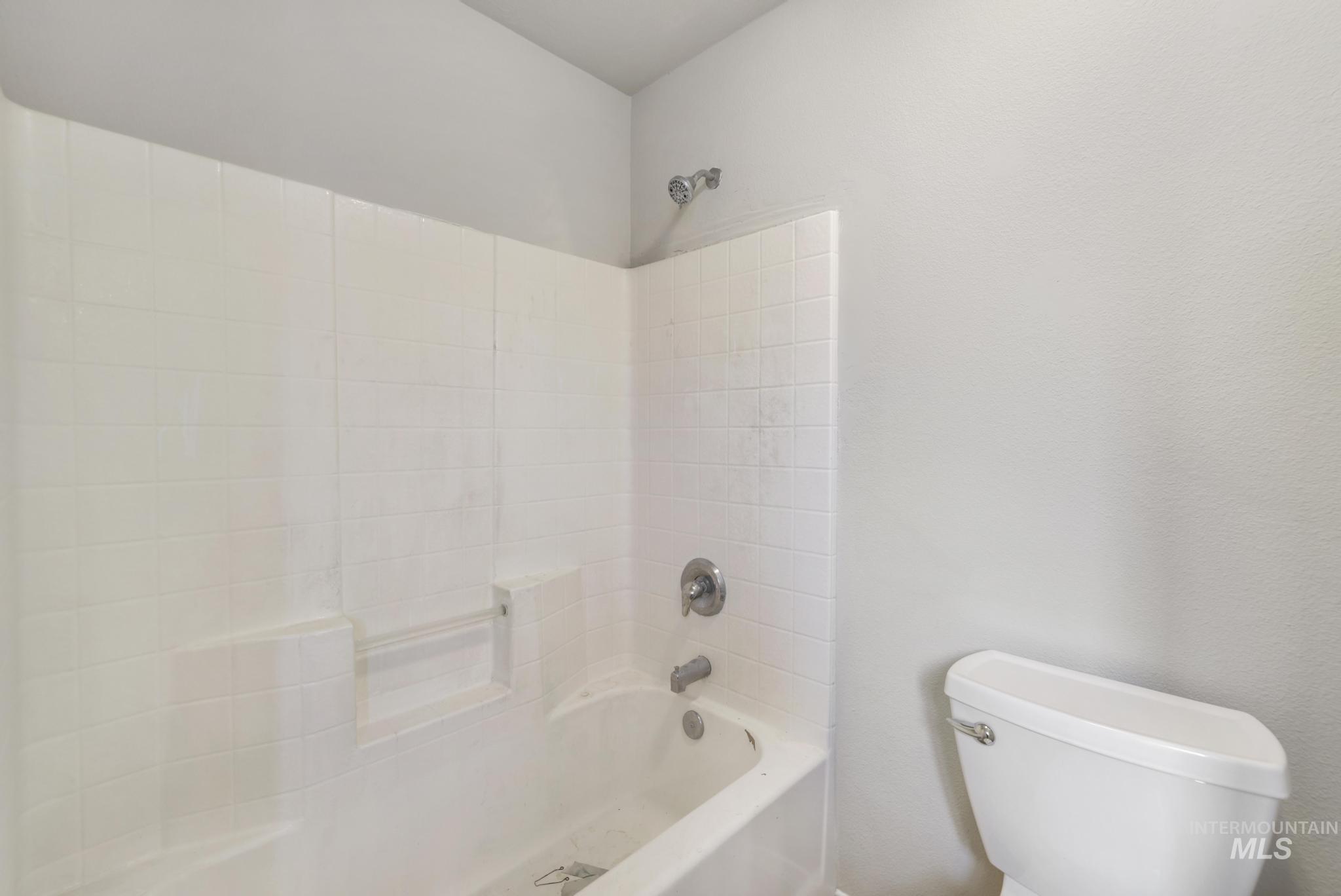 Bathroom with  shower combination and toilet