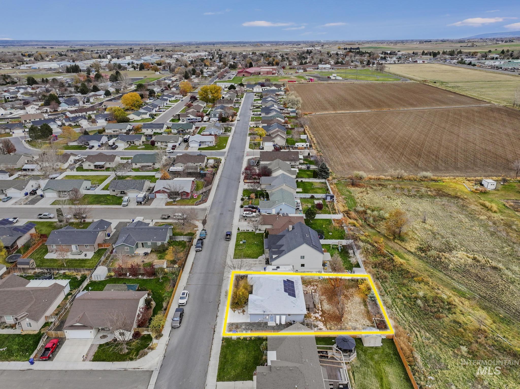 Aerial perspective of suburban area with property boundaries highlighted