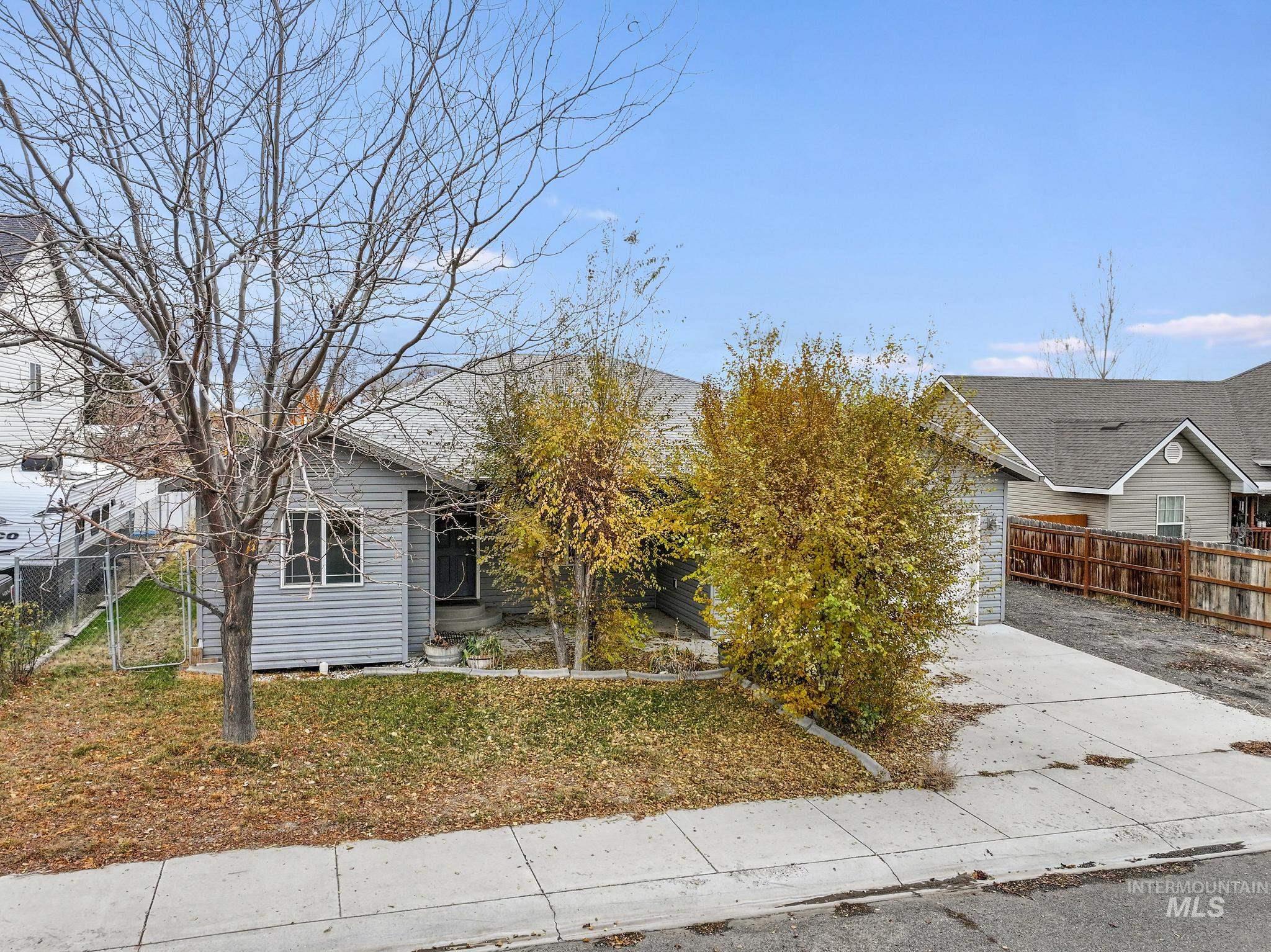 View of front facade with concrete driveway