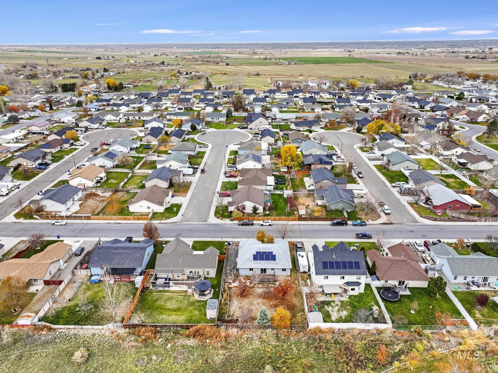 Aerial overview of property's location featuring nearby suburban area