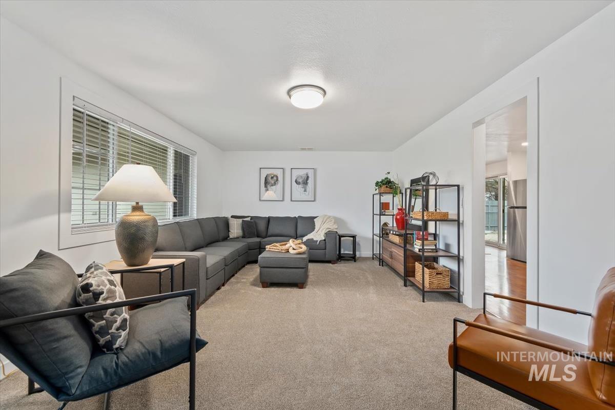Living room featuring light colored carpet
