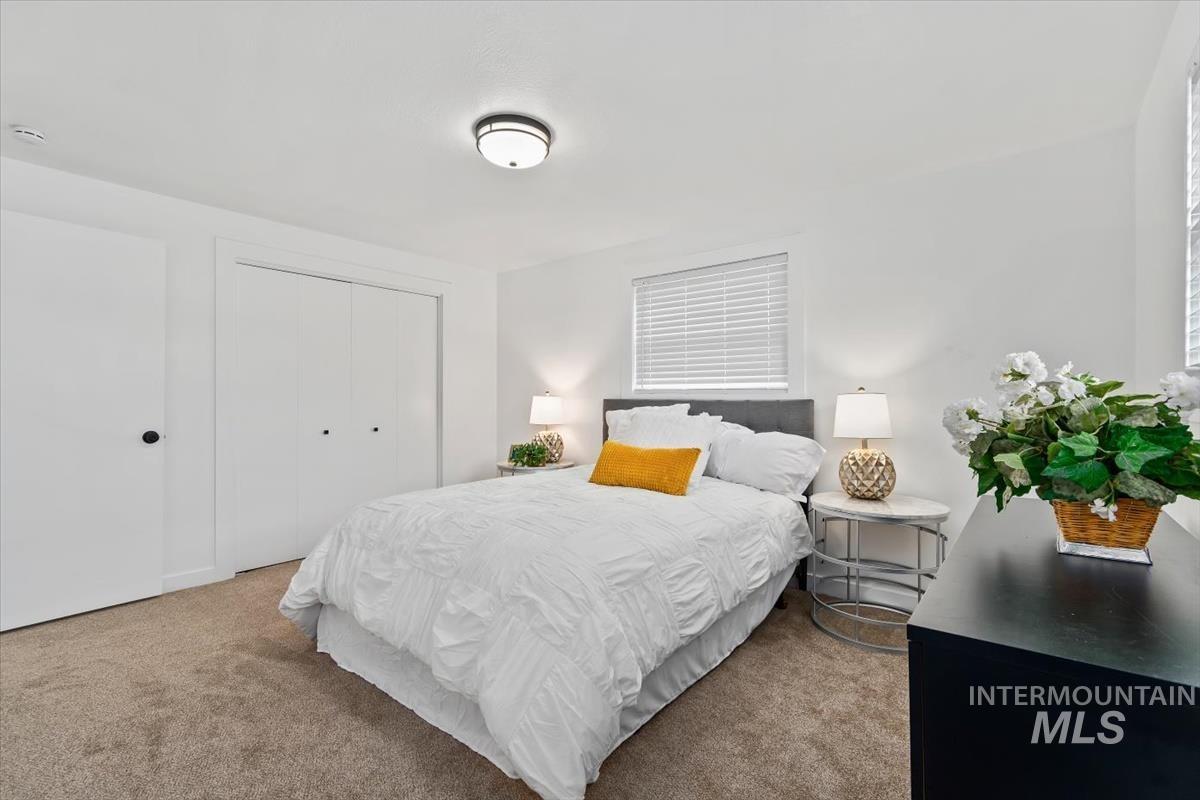 Bedroom with carpet floors and a closet