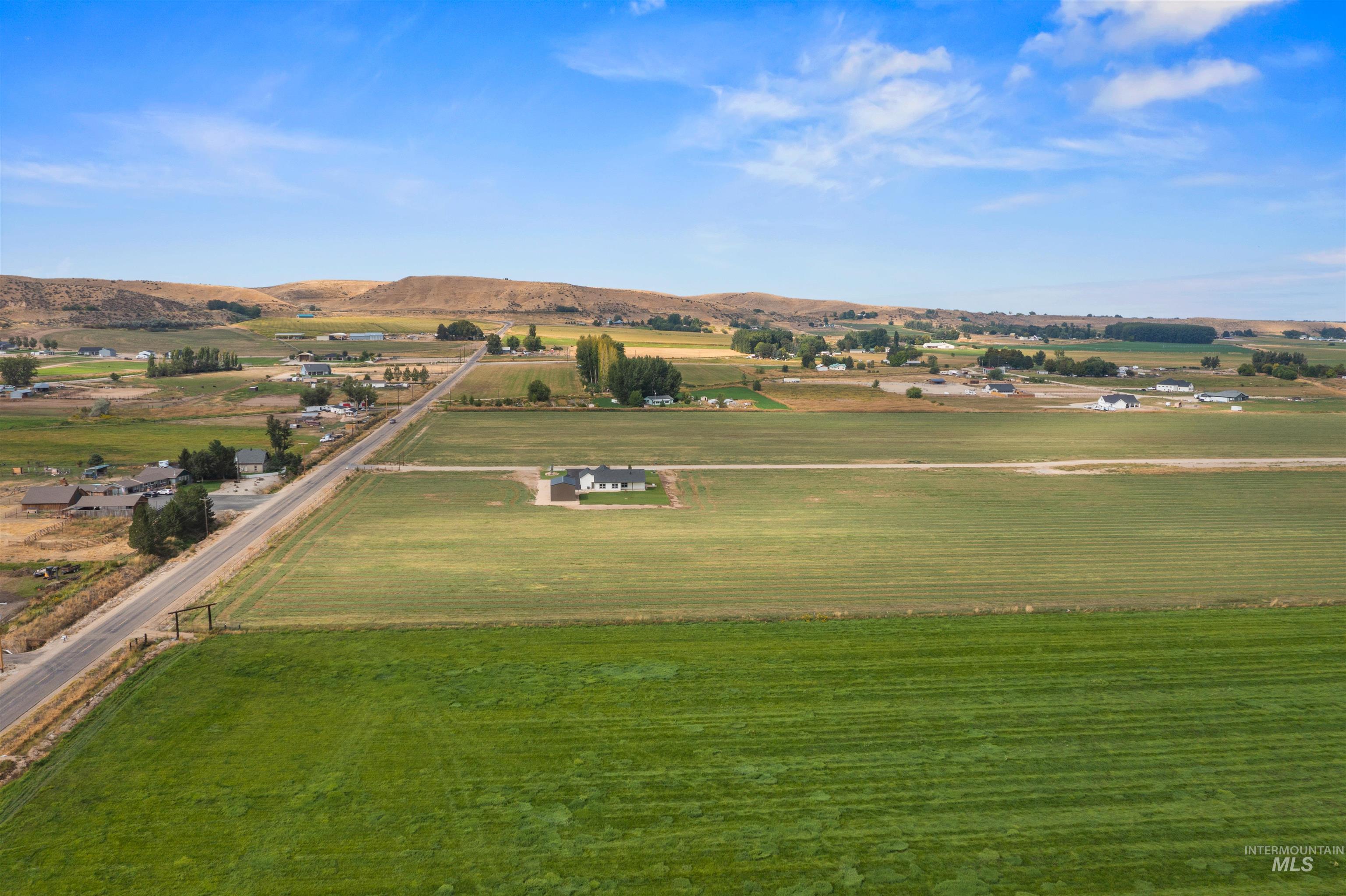 Overview of rural landscape with a mountainous background