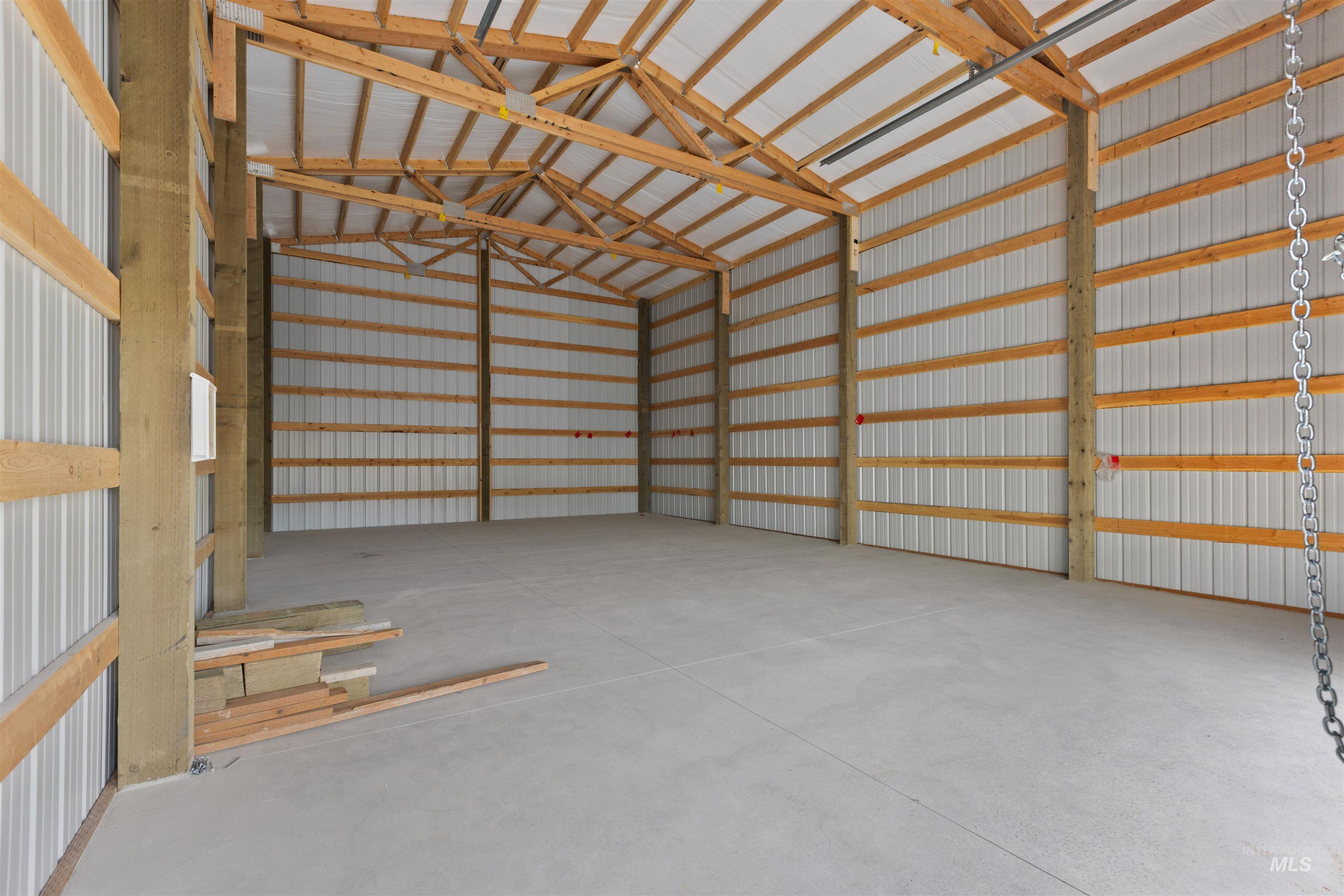 Garage featuring metal wall