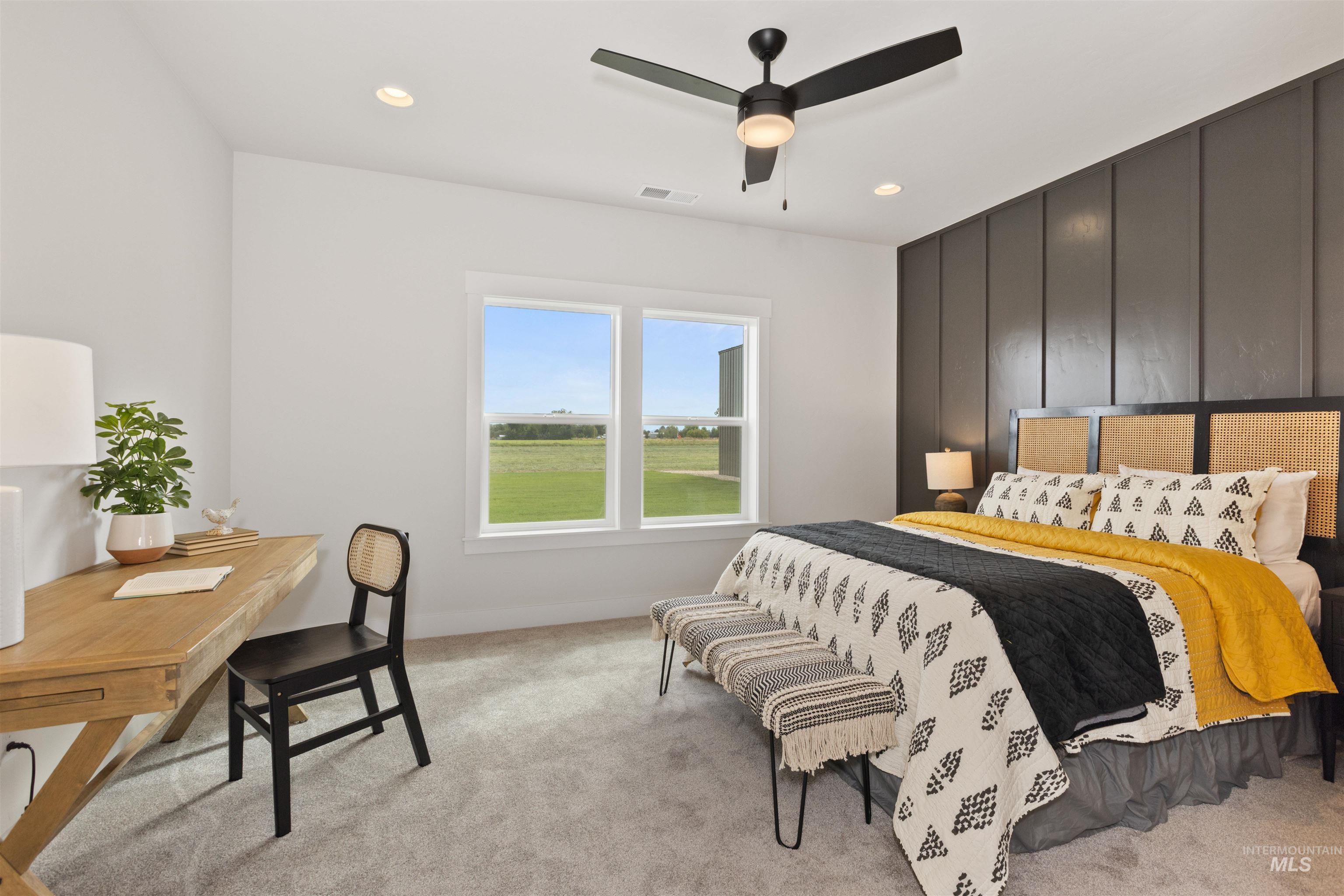Bedroom featuring light carpet, a ceiling fan, recessed lighting, and a desk