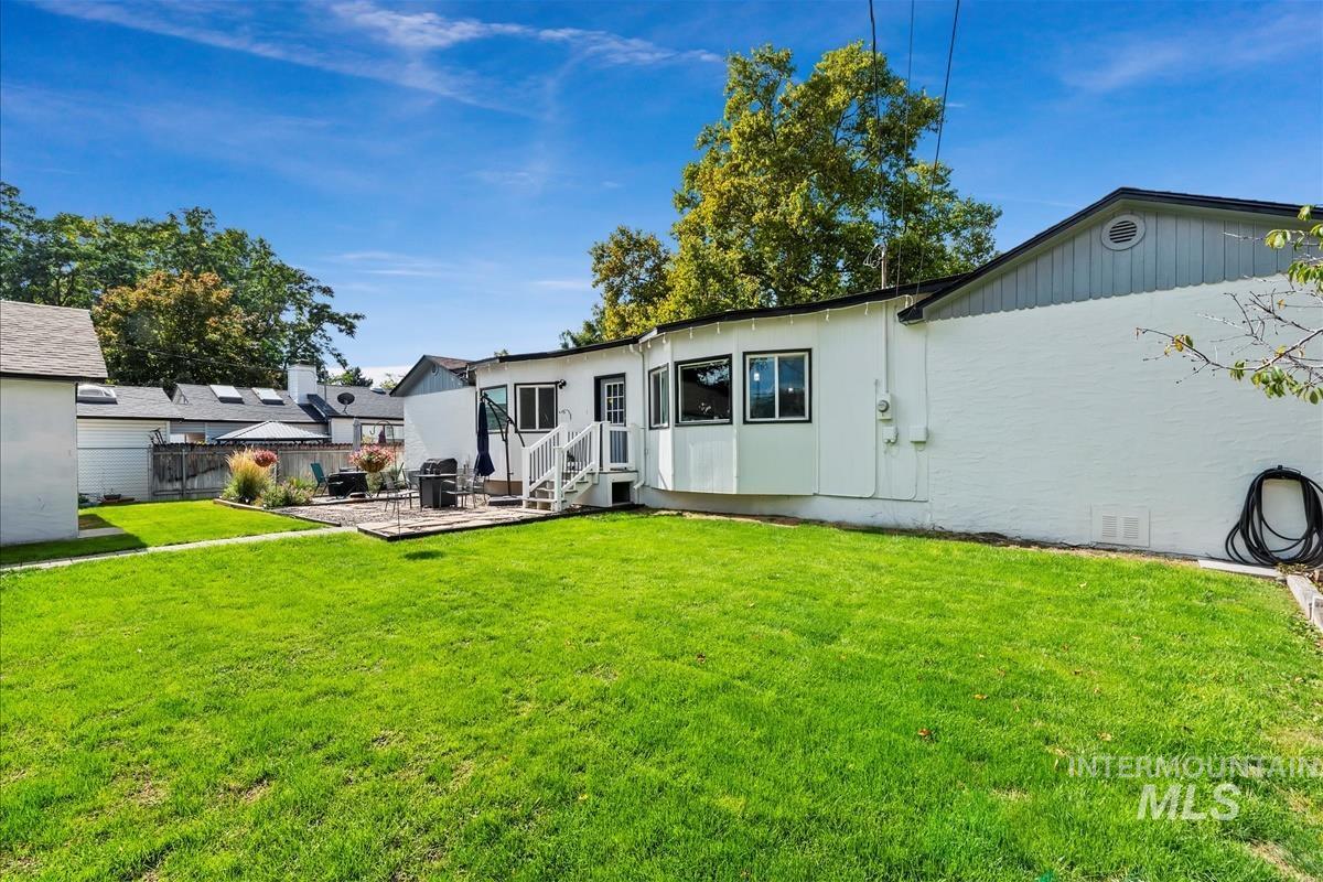 Back of property with a patio