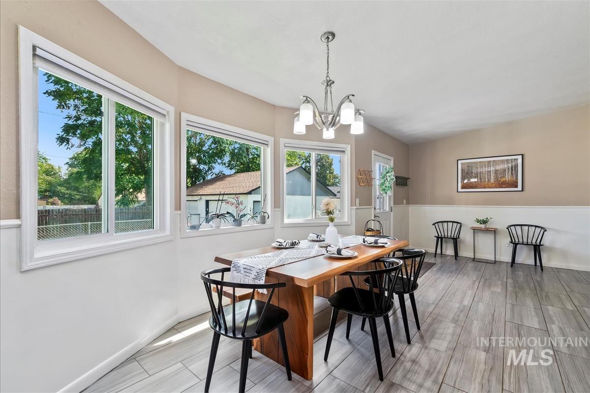 Dining room with a chandelier and wood finish floors