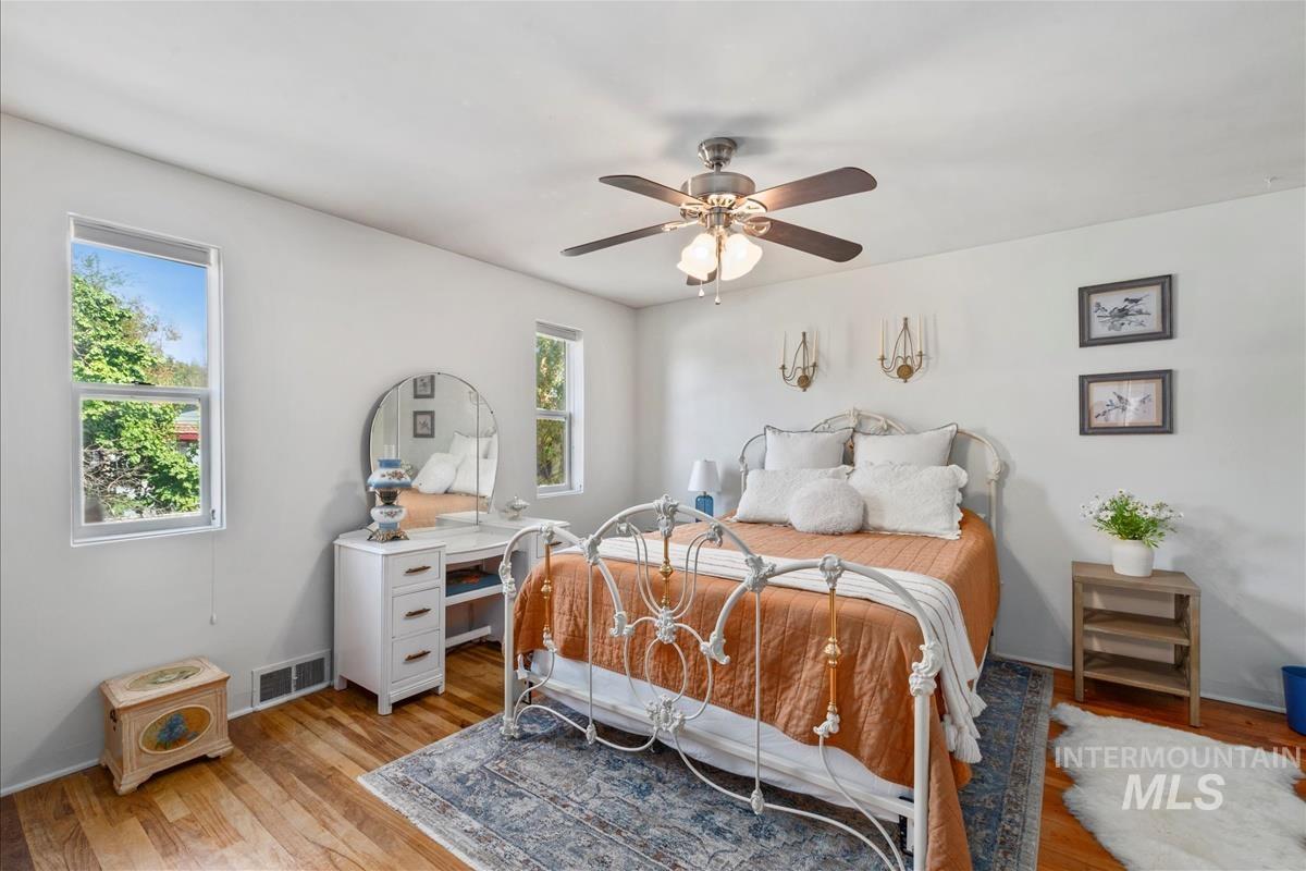 Bedroom featuring light wood-type flooring and ceiling fan