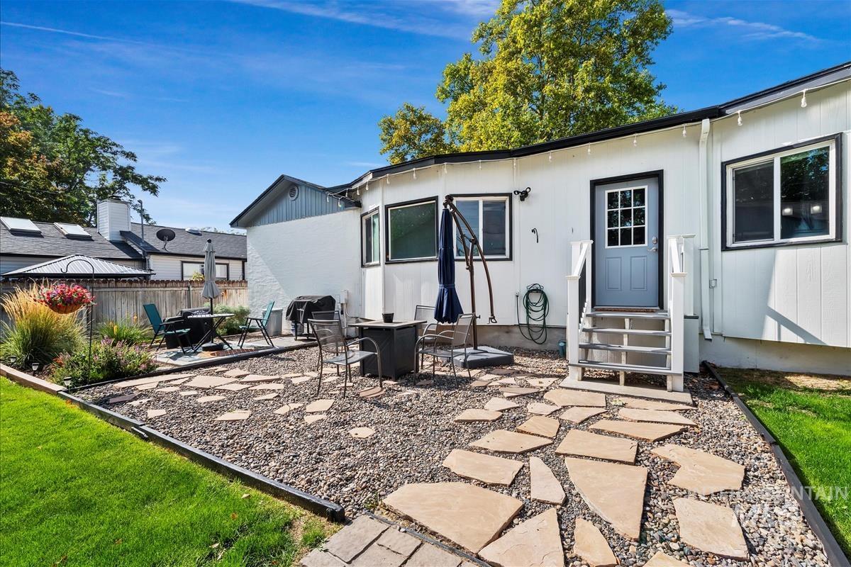 Rear view of property featuring a patio and entry steps