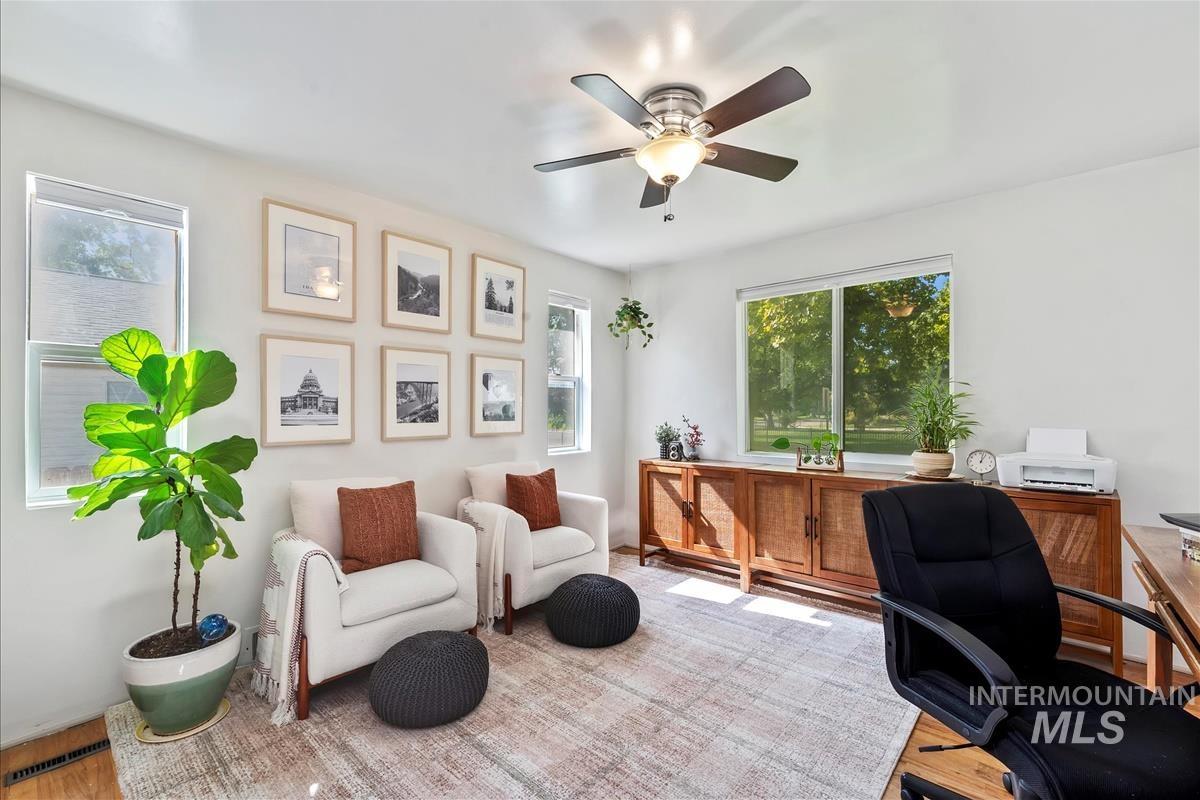 Office space featuring ceiling fan and wood finished floors