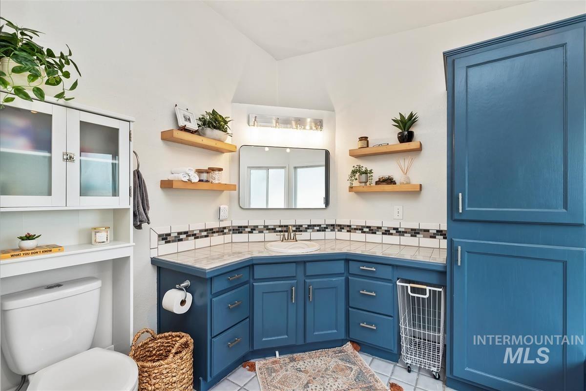 Bathroom with vanity and light tile patterned floors