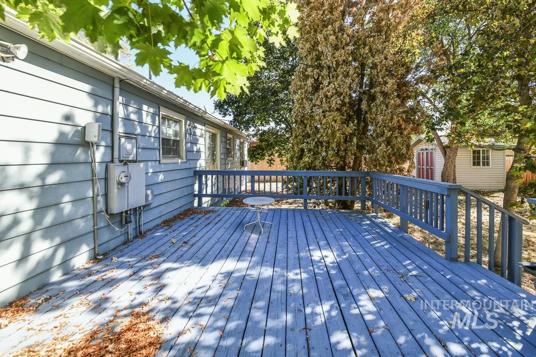 Wooden deck featuring an outdoor structure