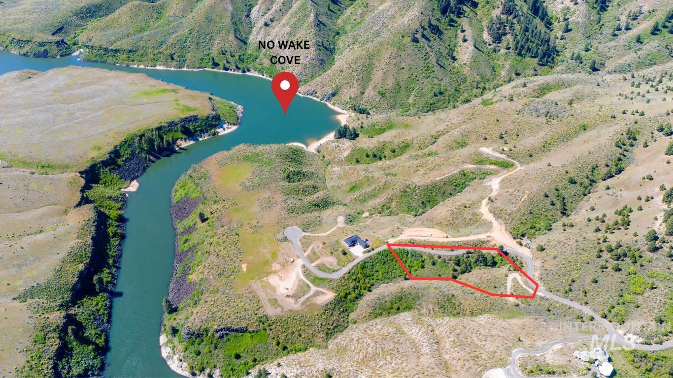 View of property location featuring a large body of water and property boundaries highlighted