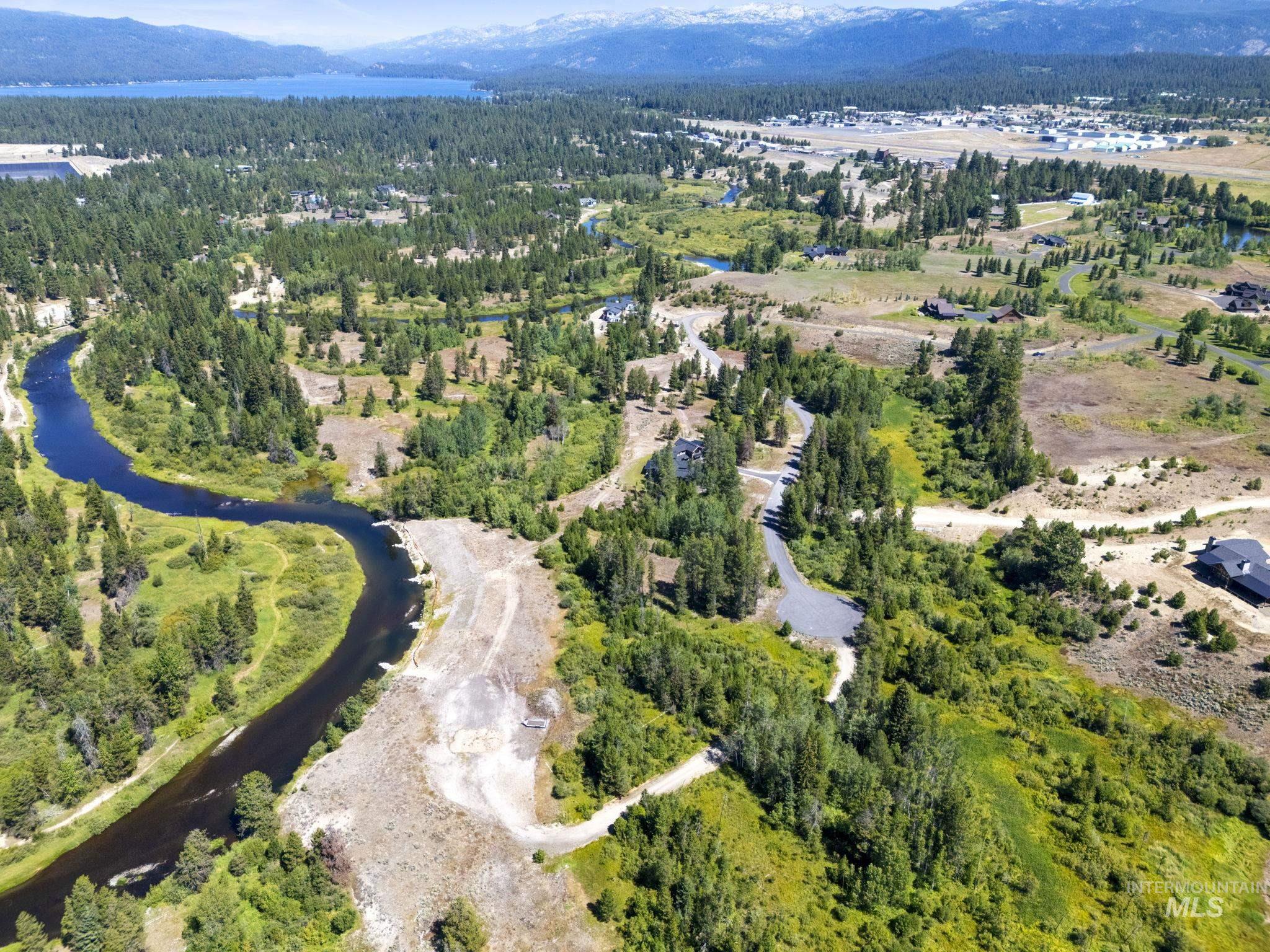 View of property location with a water and mountain view