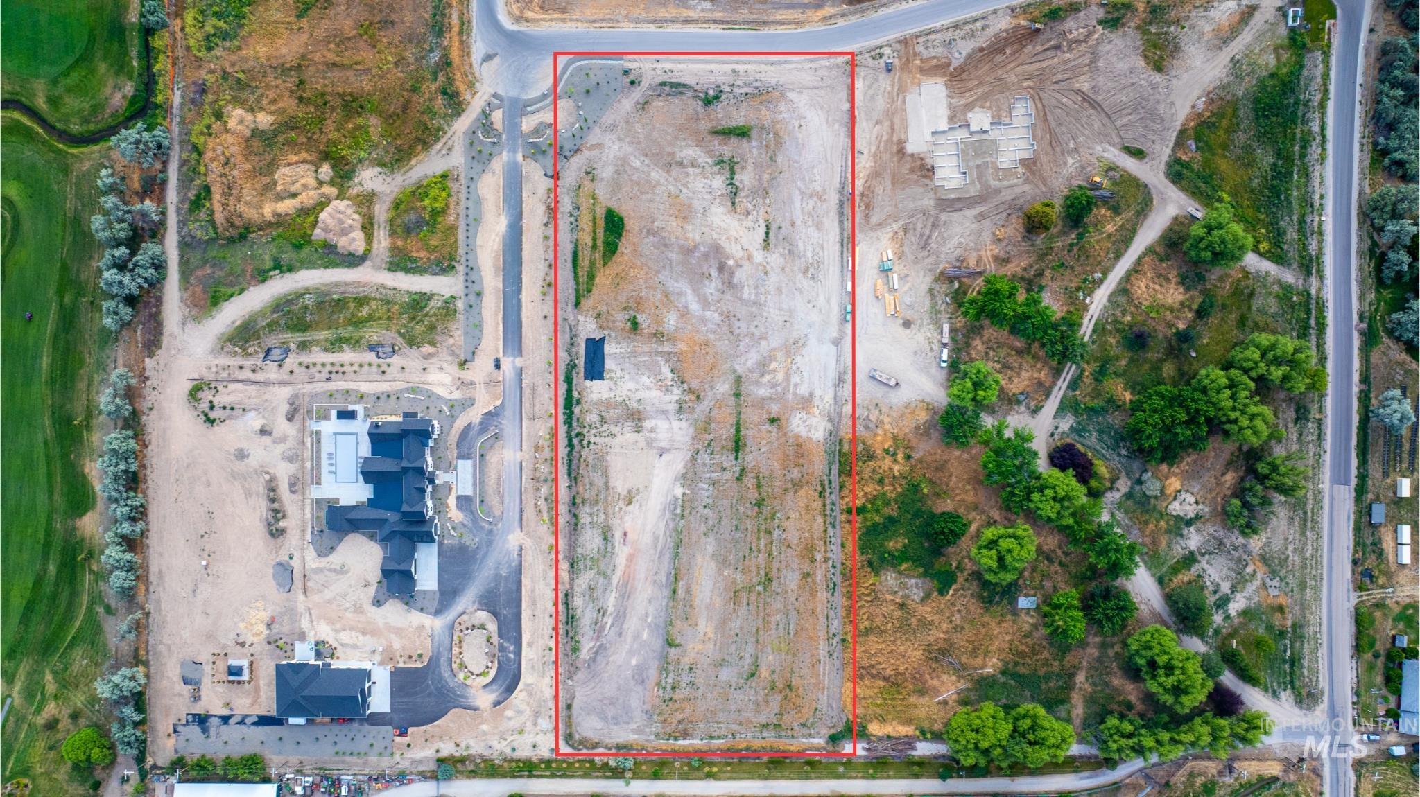 Aerial view of property and surrounding area with property boundaries highlighted