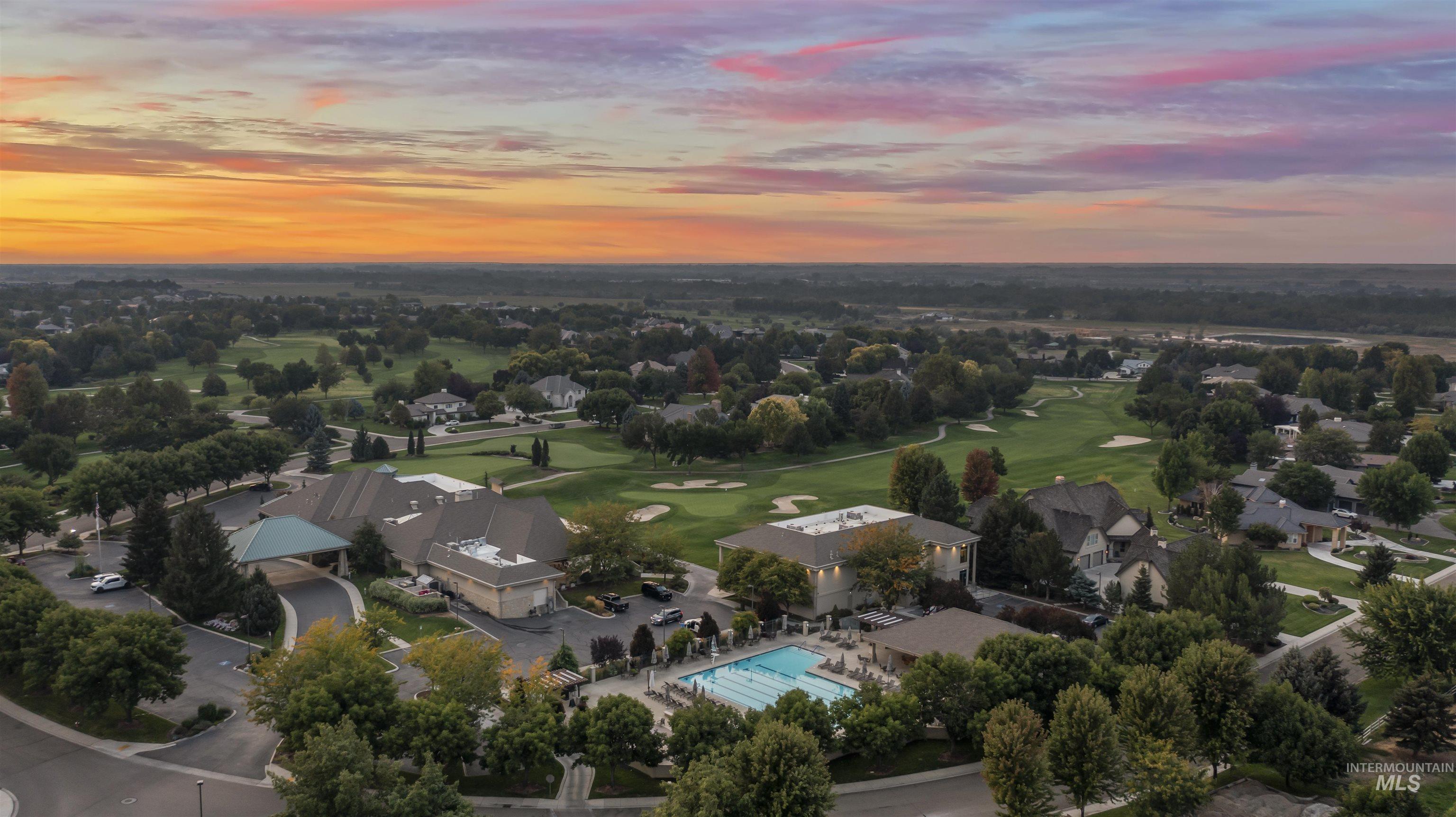 Aerial view of a golf course and a pool