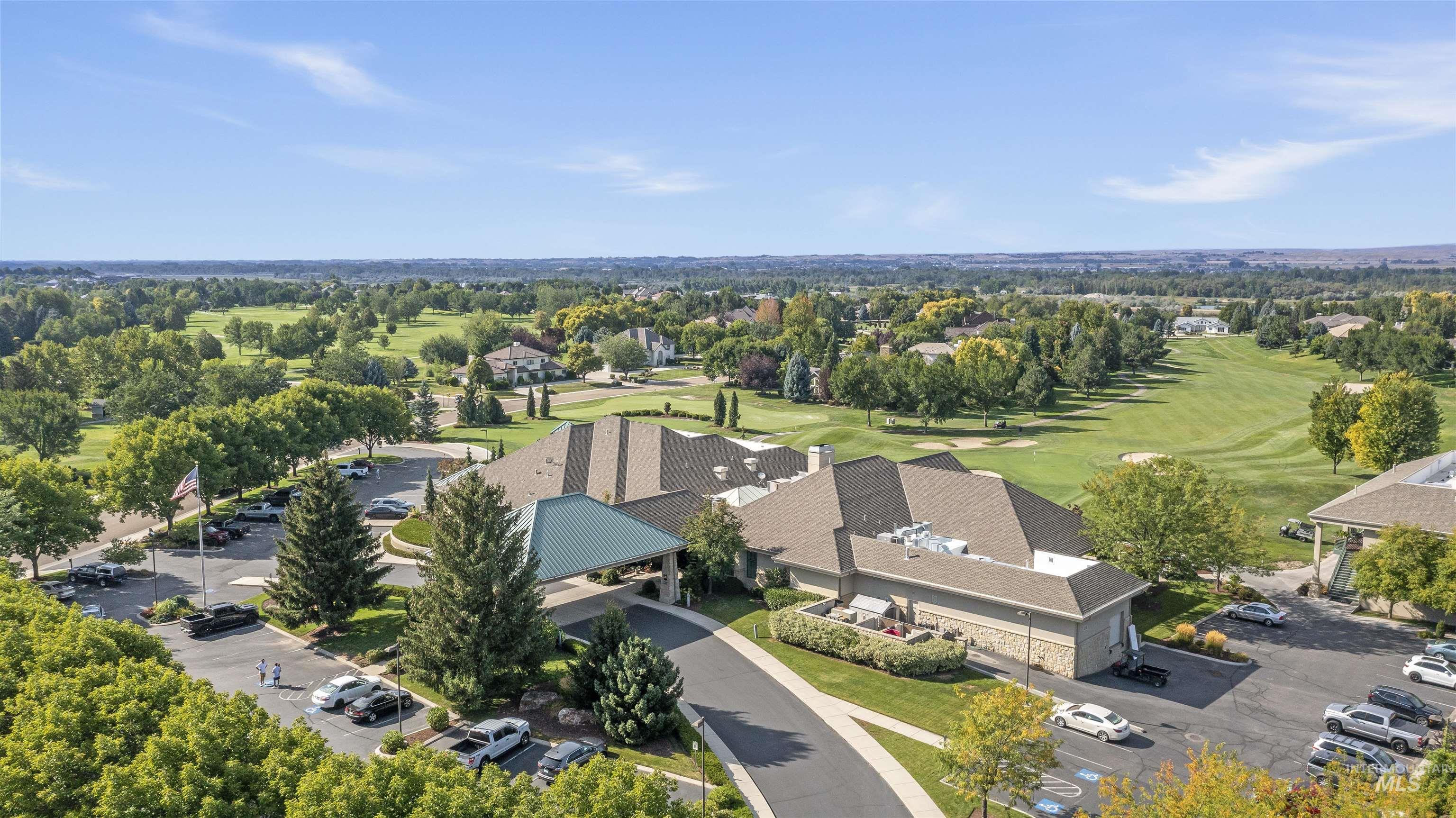 Aerial view of residential area featuring a local golf course