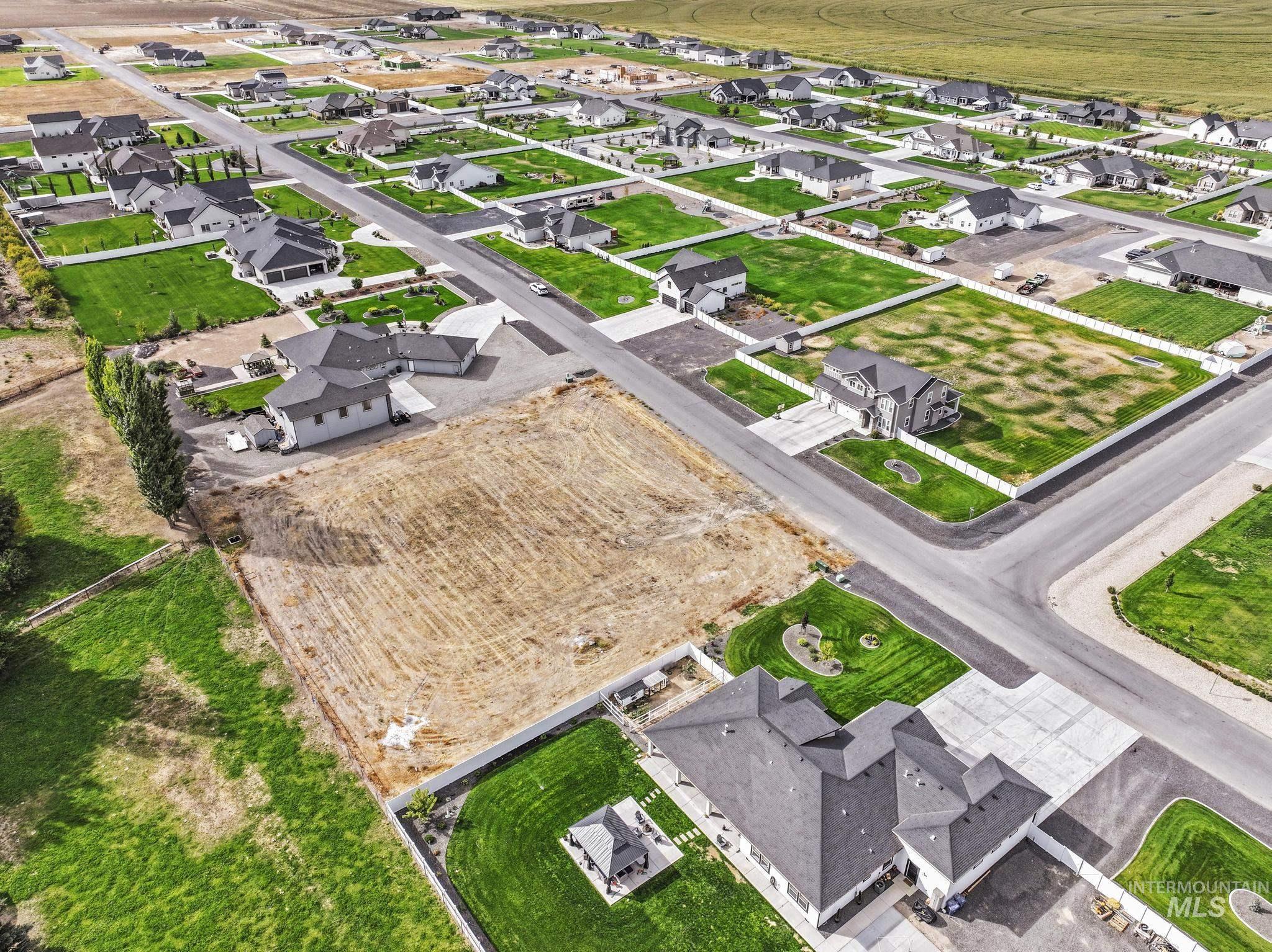 Aerial overview of property's location featuring nearby suburban area
