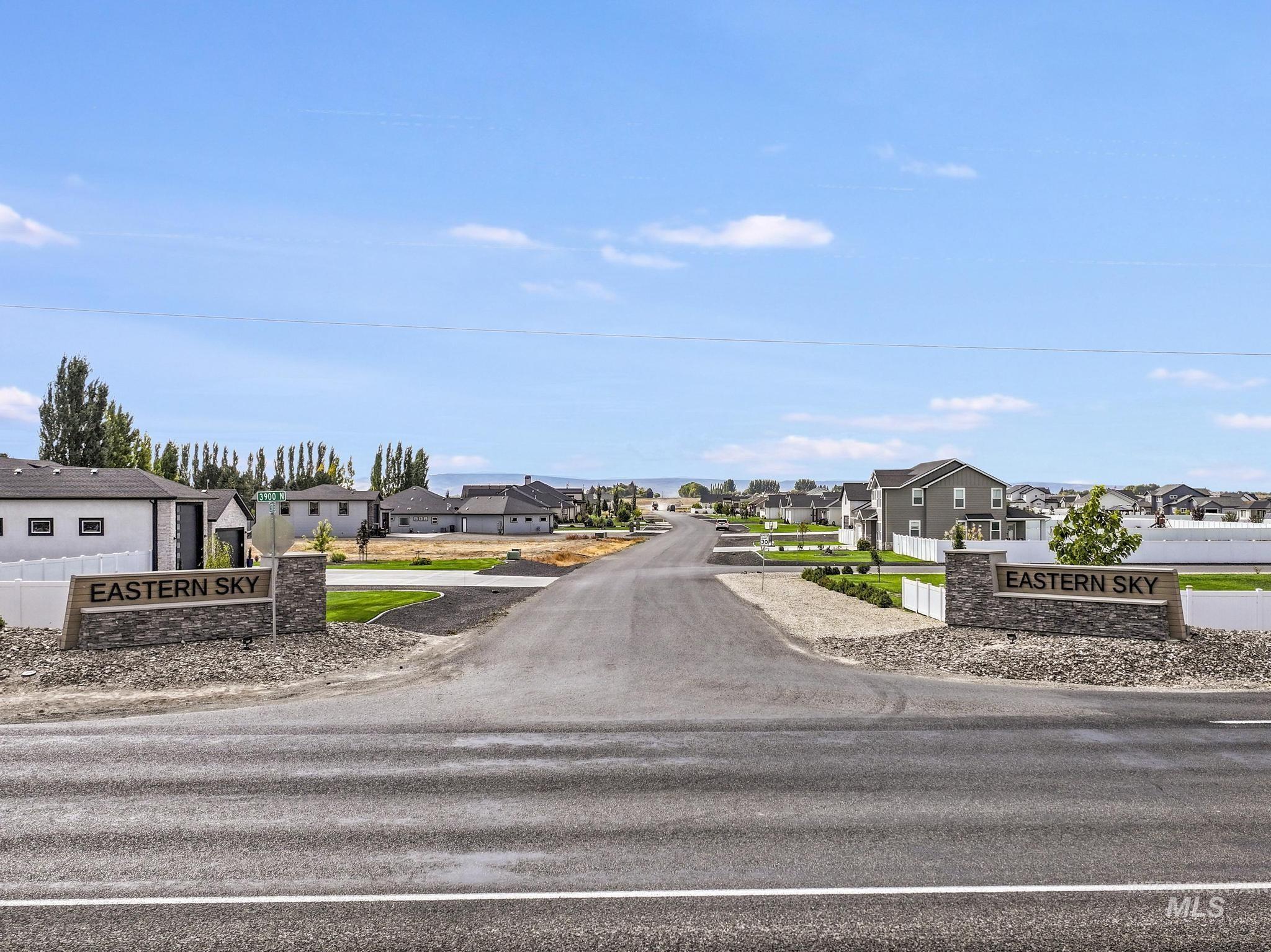 View of asphalt street with a residential view