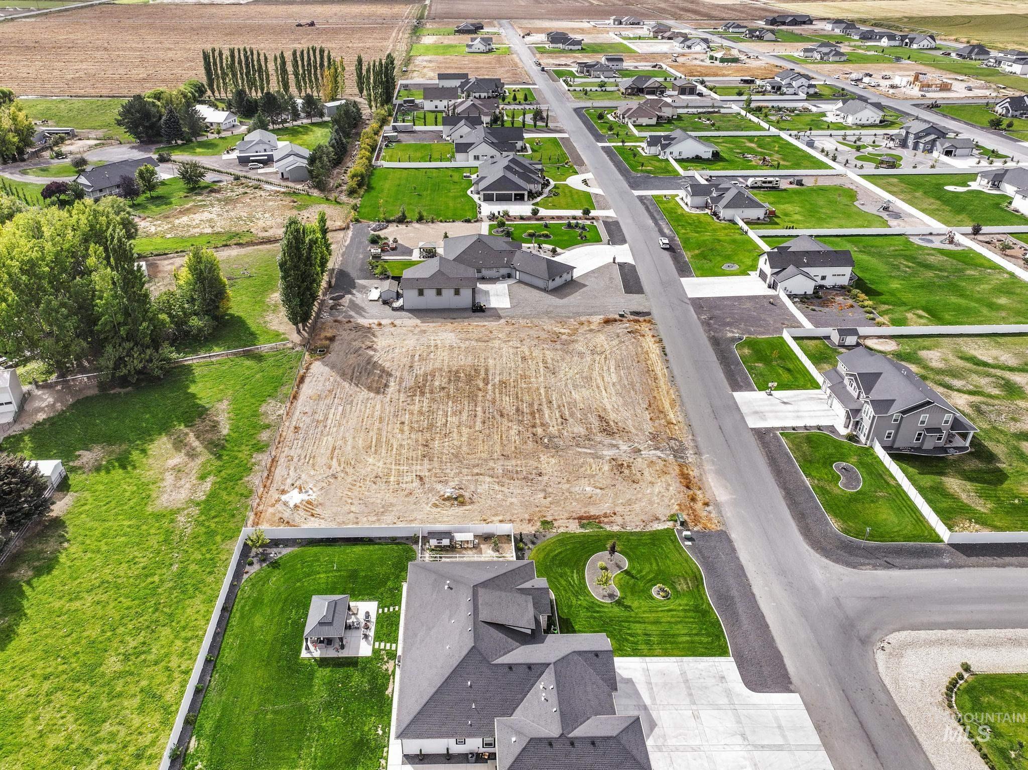 Aerial view of property's location with nearby suburban area