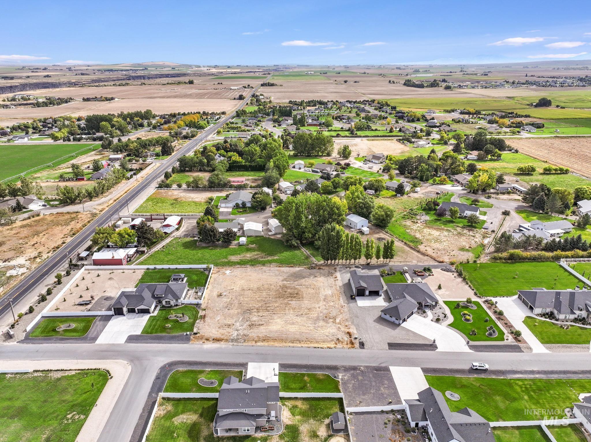 View of property location with rural landscape and nearby suburban area