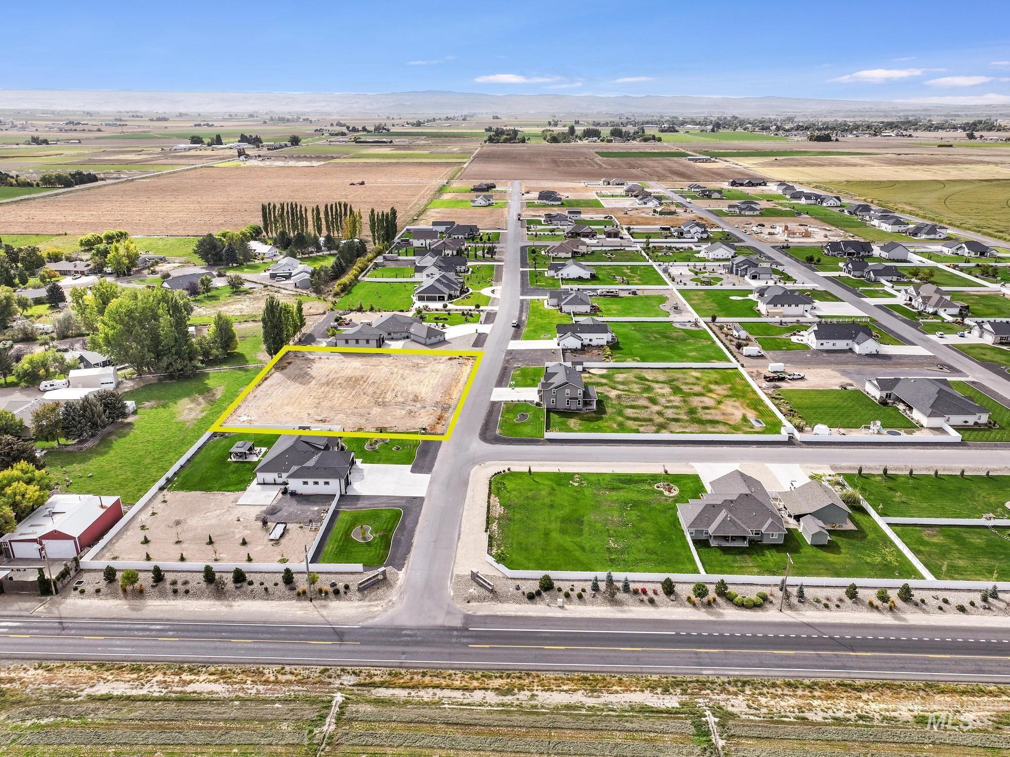 Aerial view of residential area with property boundaries highlighted