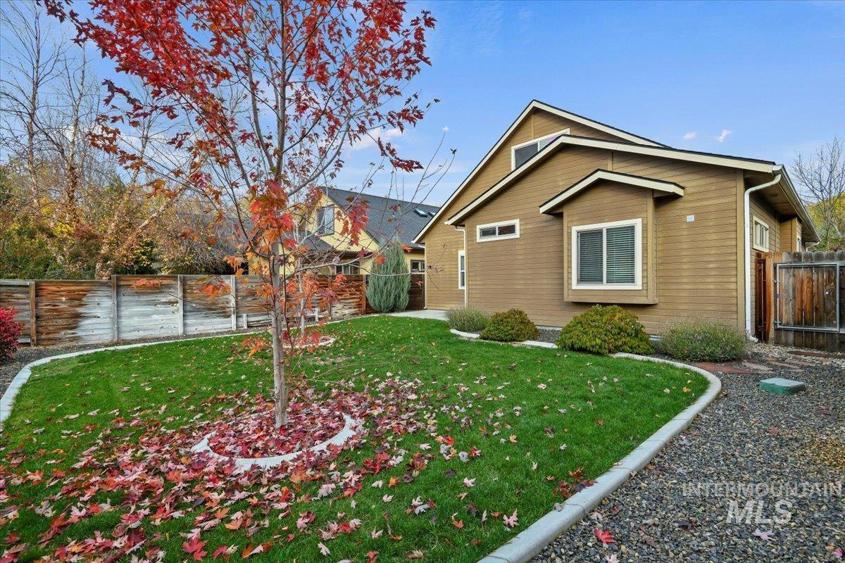 View of side of property with a fenced backyard