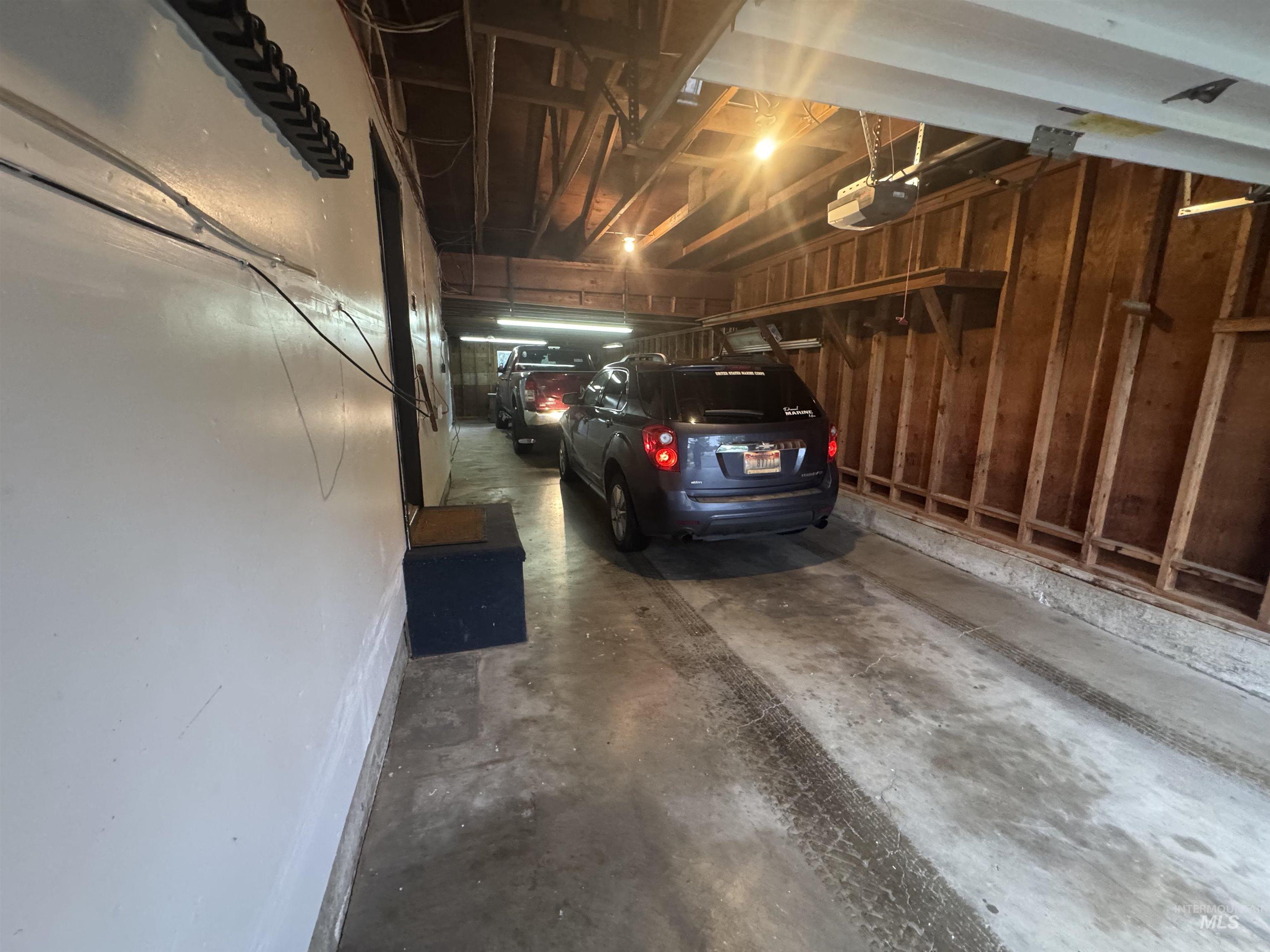 Garage featuring a garage door opener