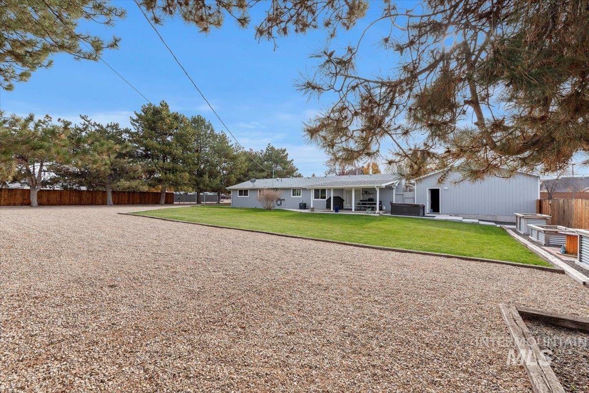Back of house featuring a fenced backyard and a patio area