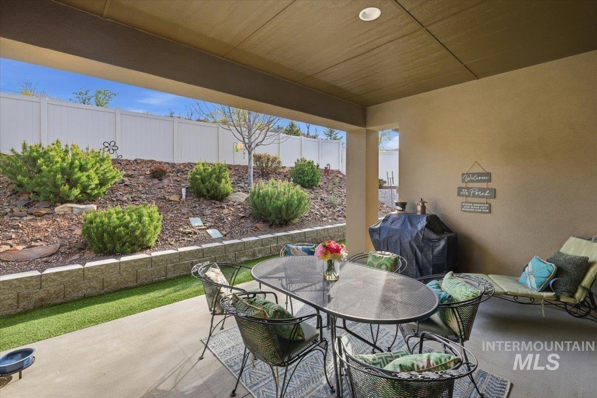View of patio / terrace with outdoor dining area and a grill