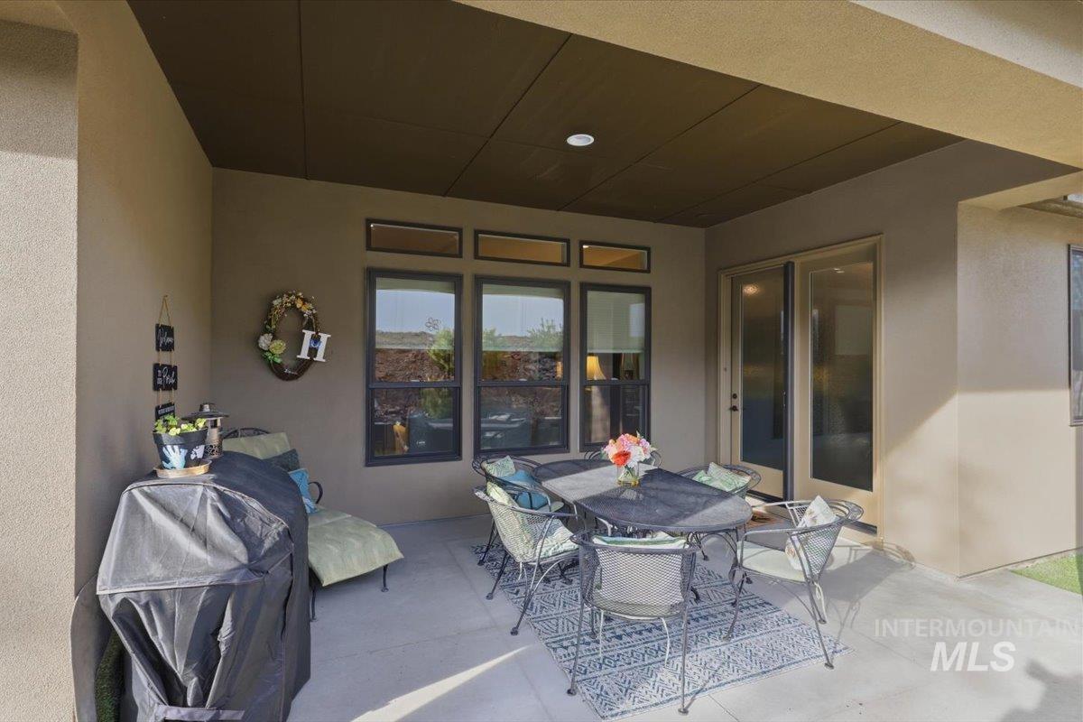 View of patio featuring outdoor dining area