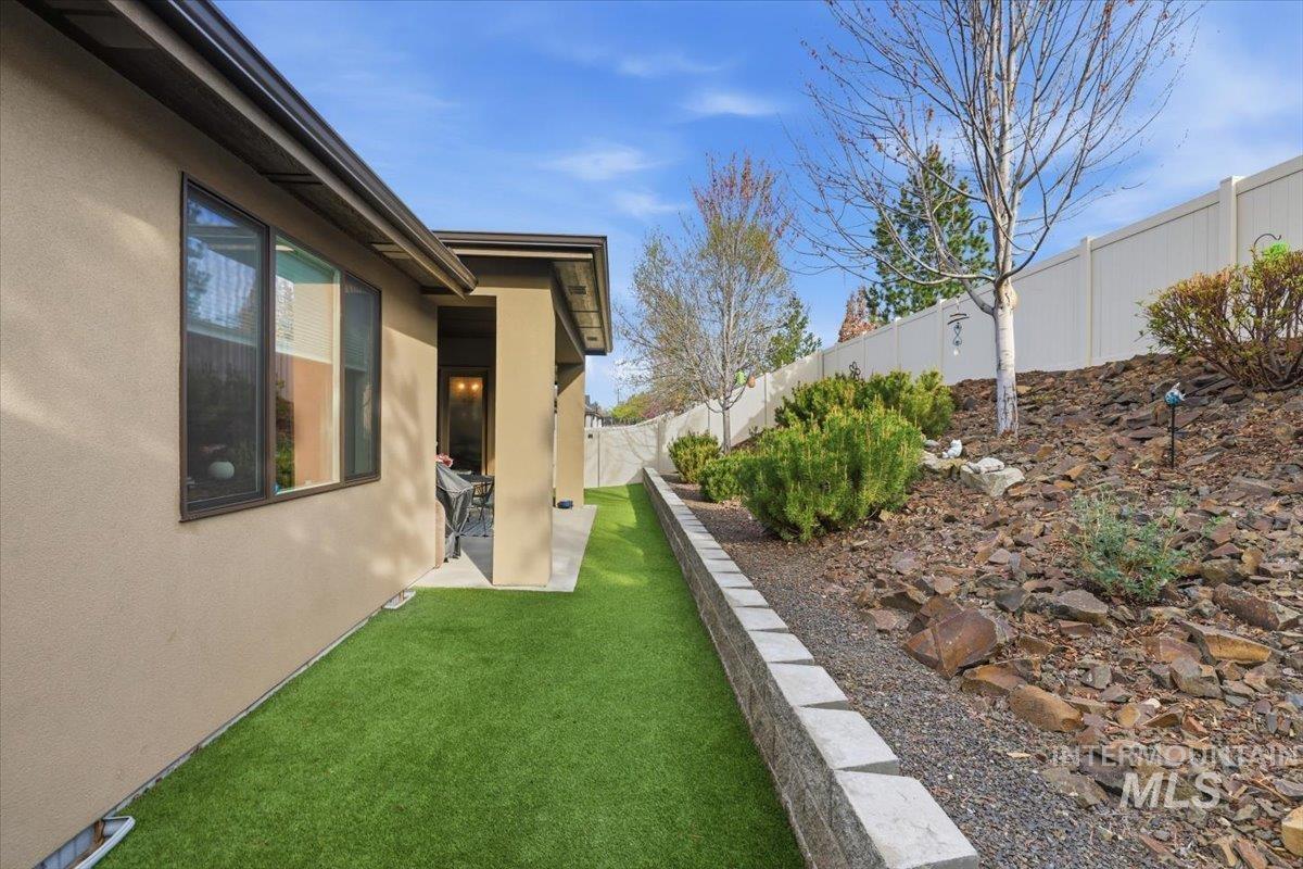 Fenced backyard with a patio area