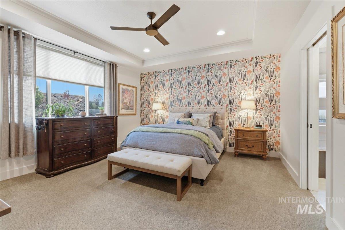 Bedroom featuring ceiling fan, light carpet, wallpapered walls, crown molding, and recessed lighting