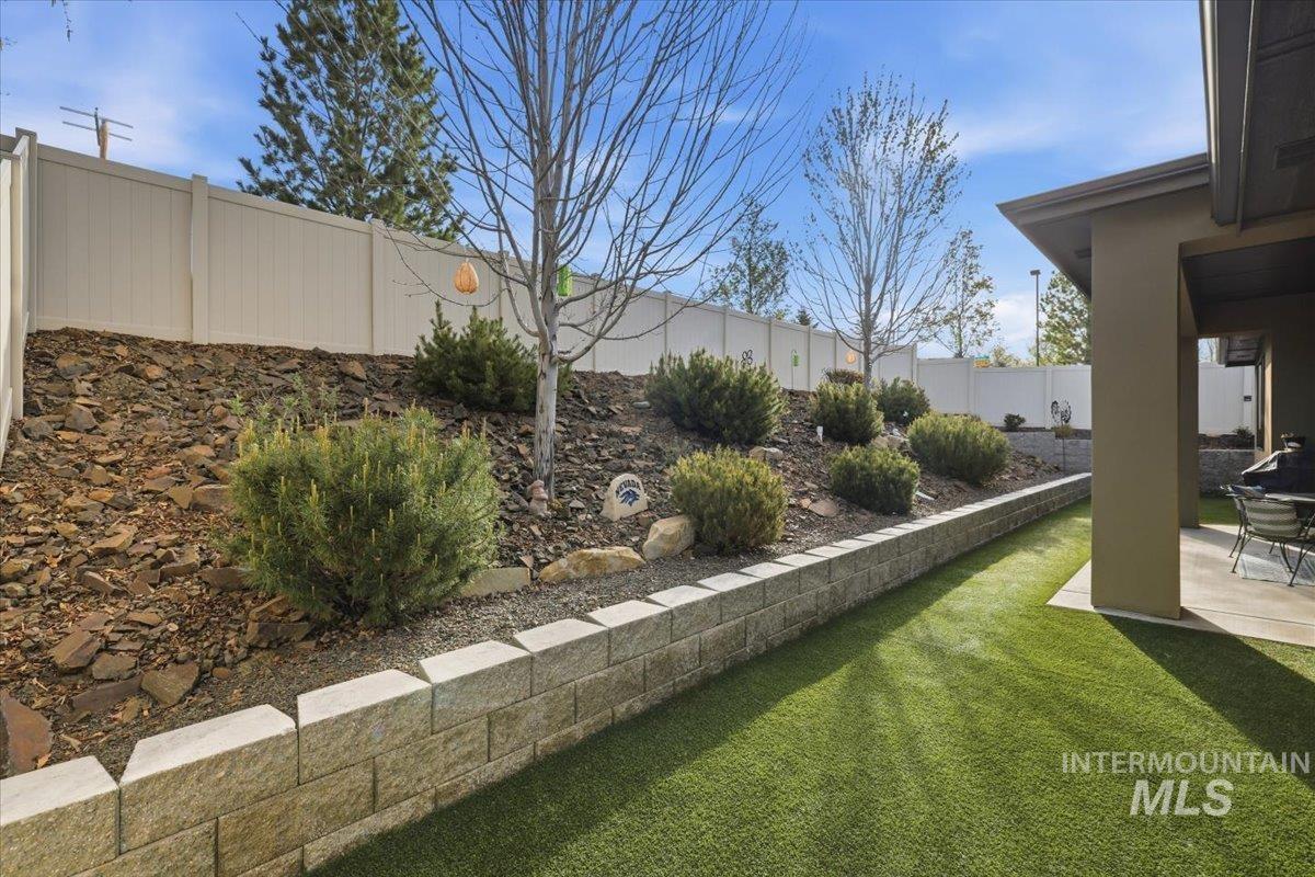 Fenced backyard featuring a patio