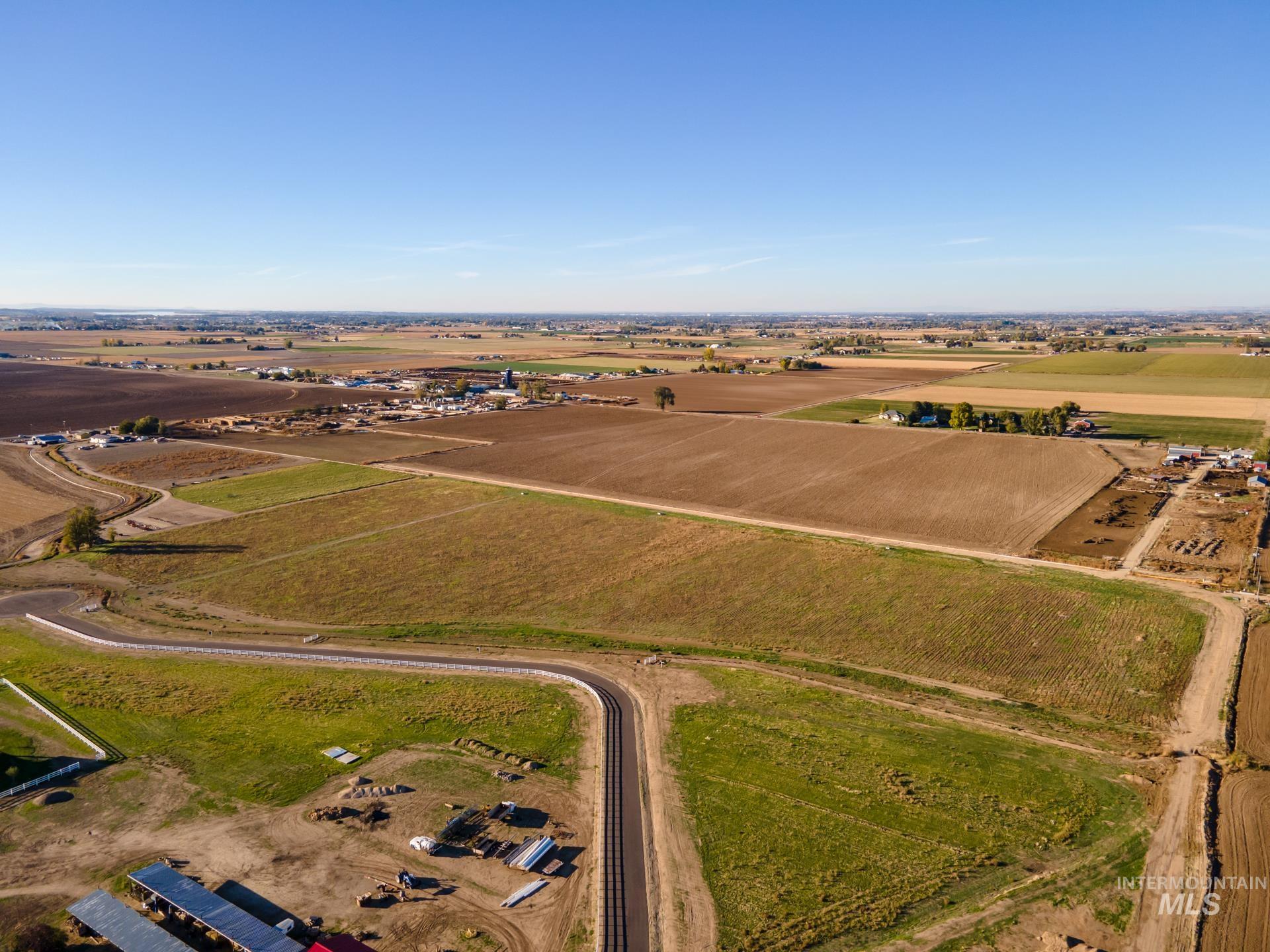 View of property location with rural landscape and rows of crops