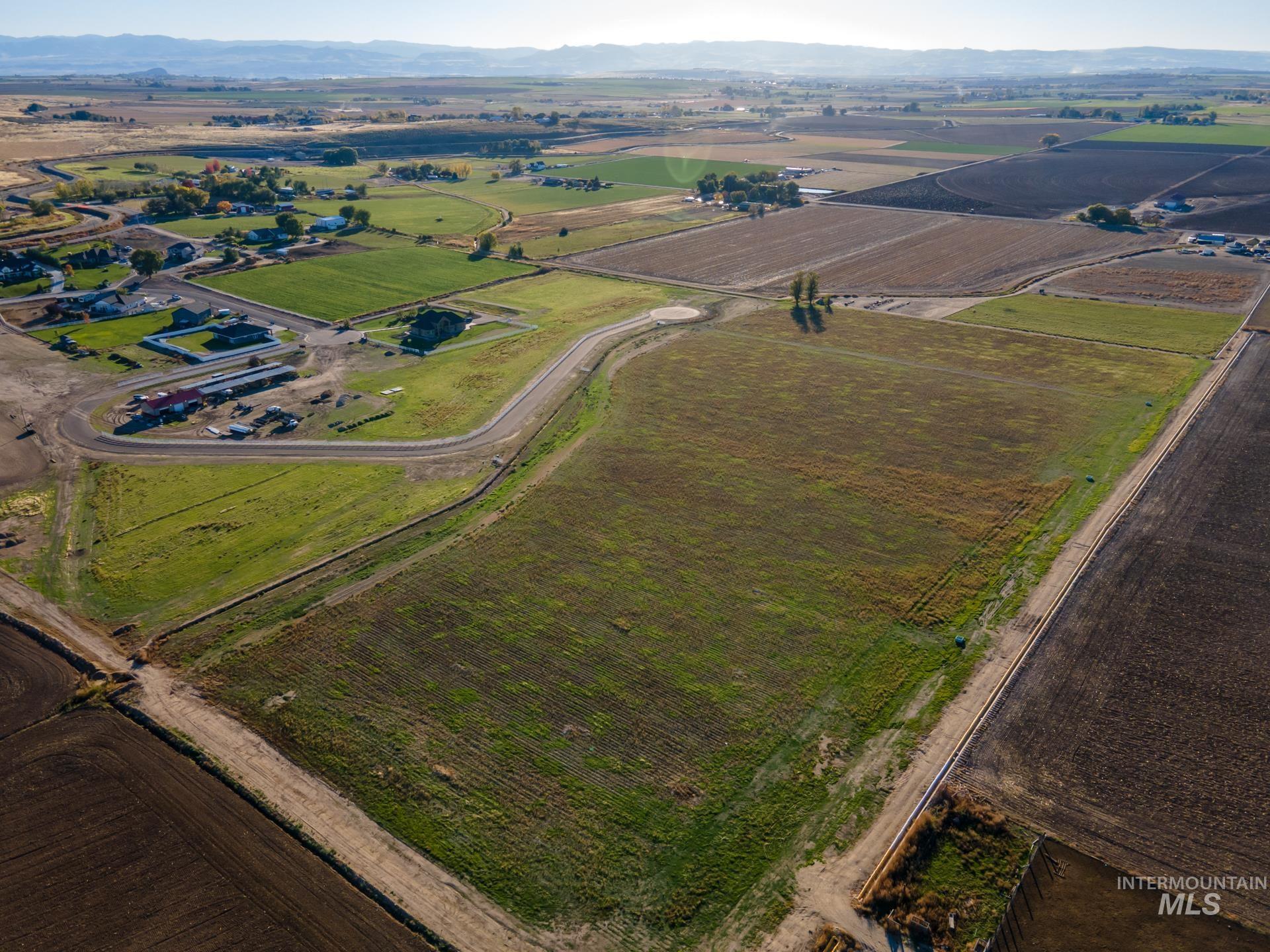View of property location featuring rural landscape and a mountainous background