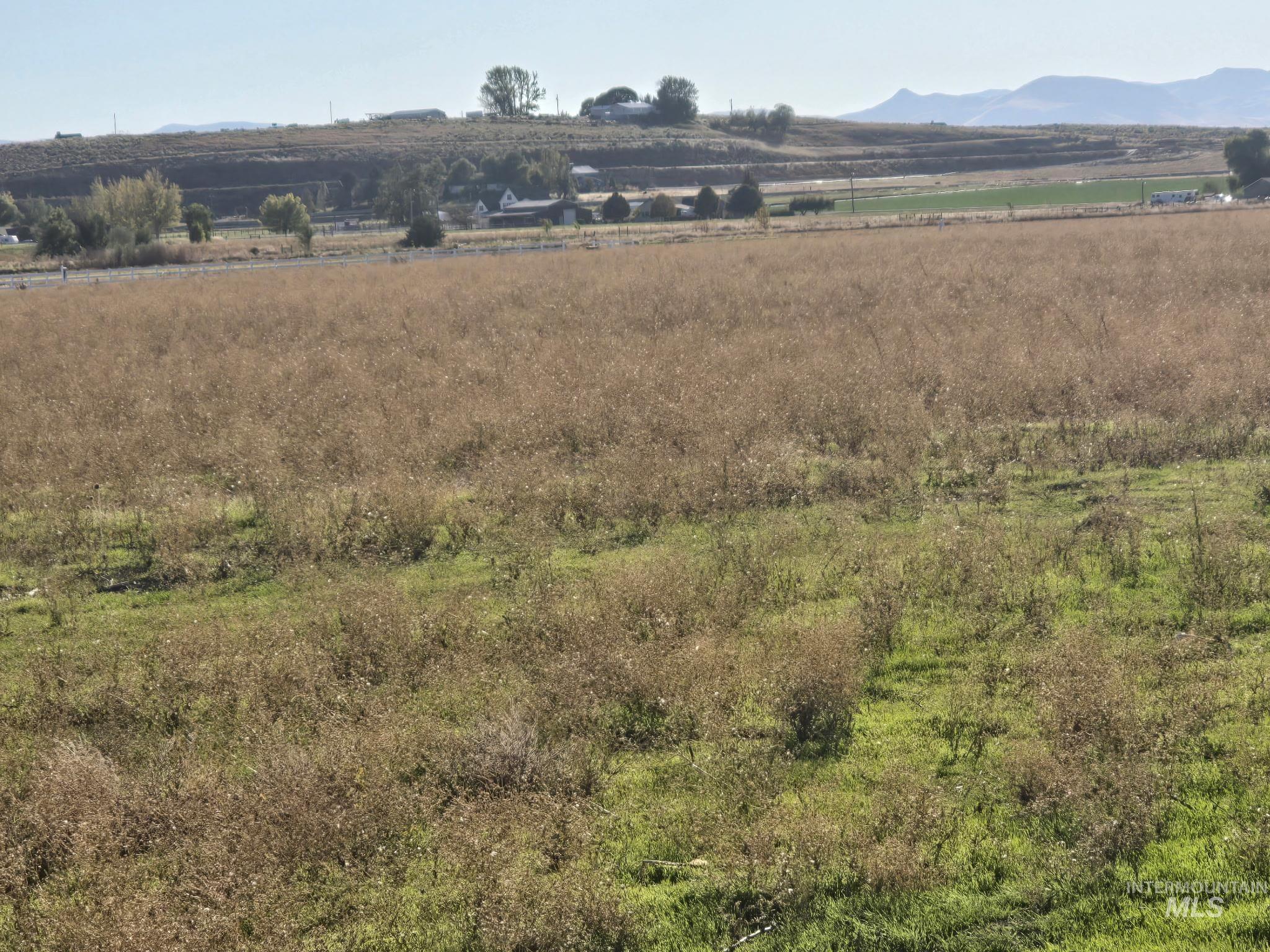 View of mountain backdrop featuring rural landscape