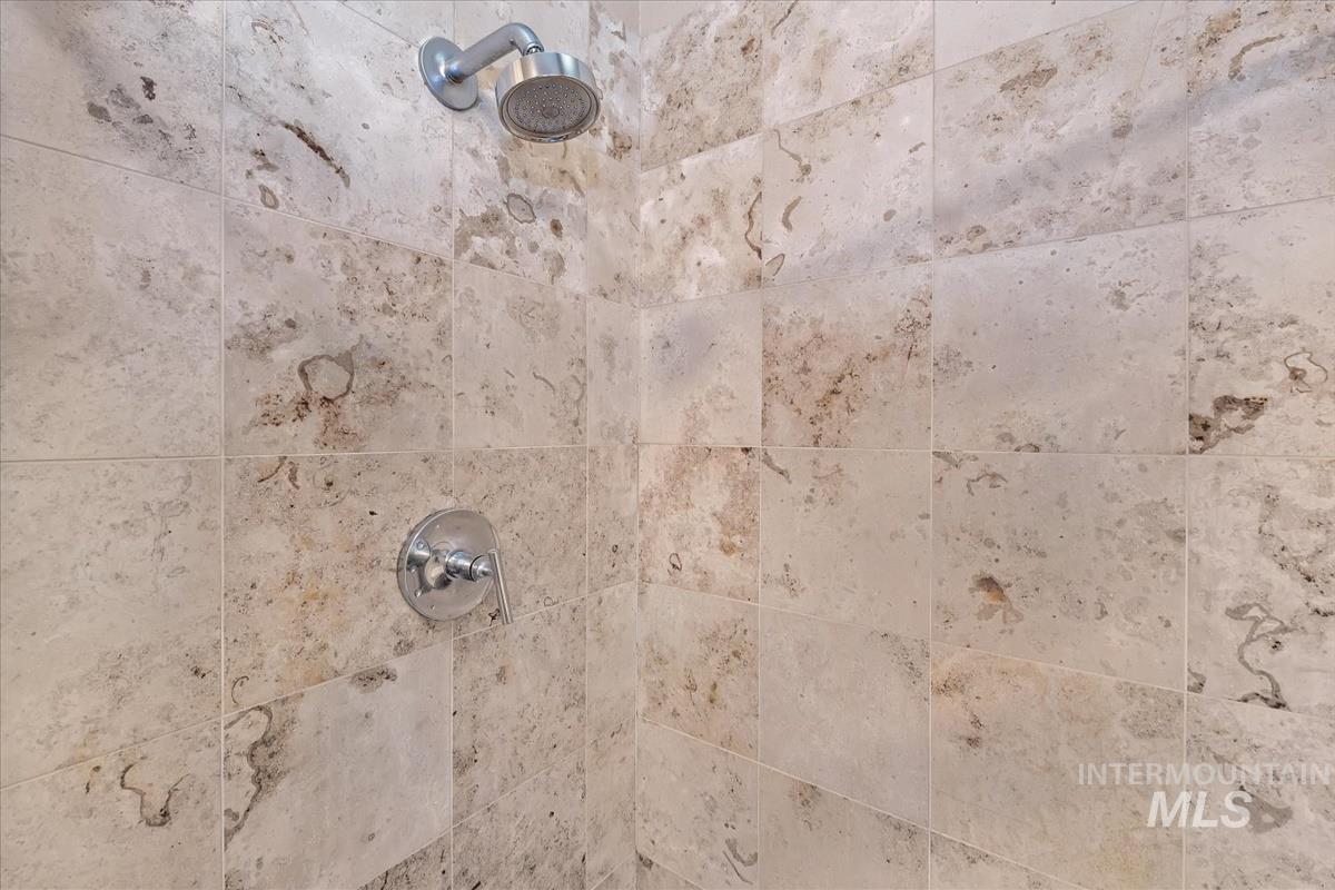 Bathroom view of a tile shower