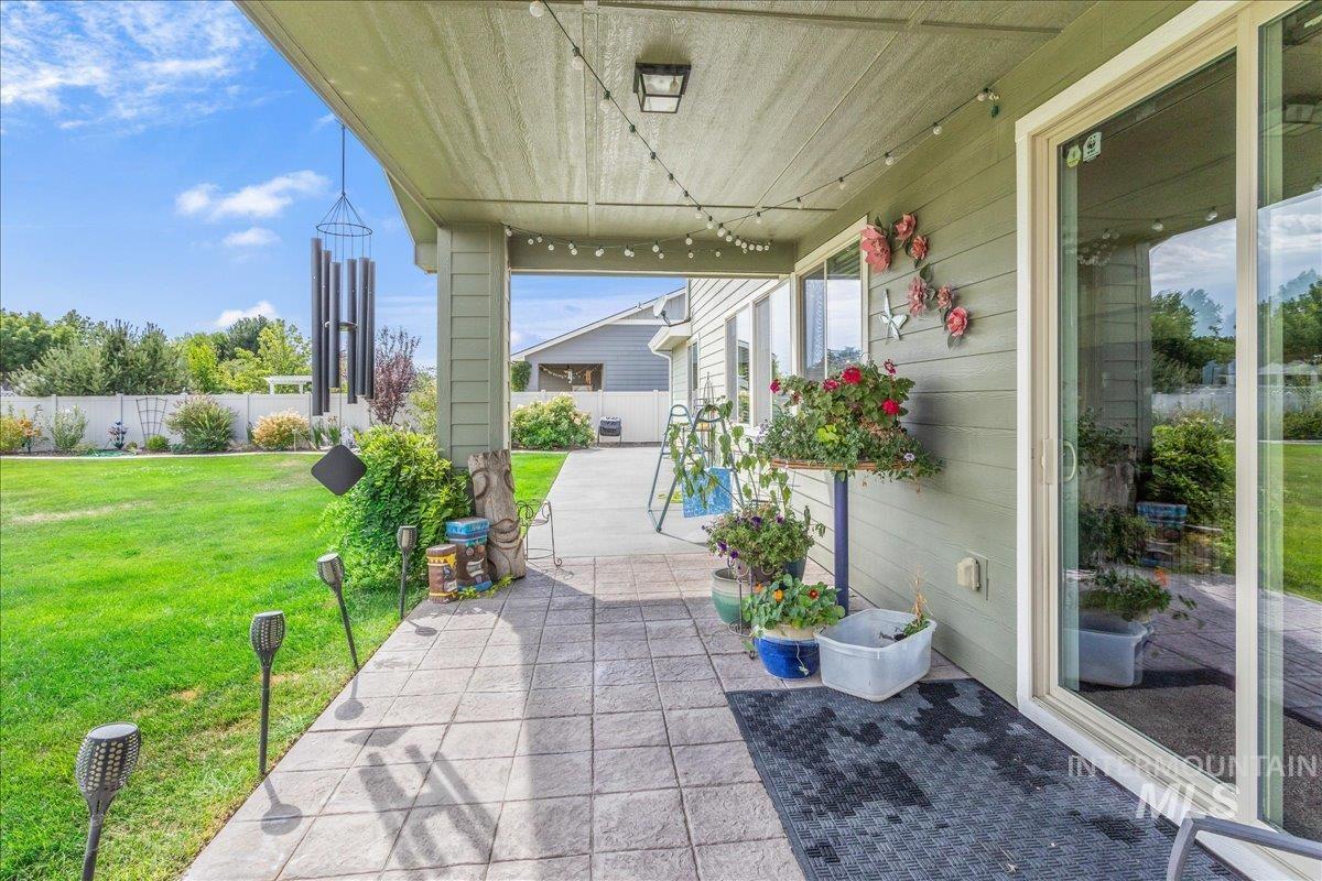 Fenced backyard with a patio area